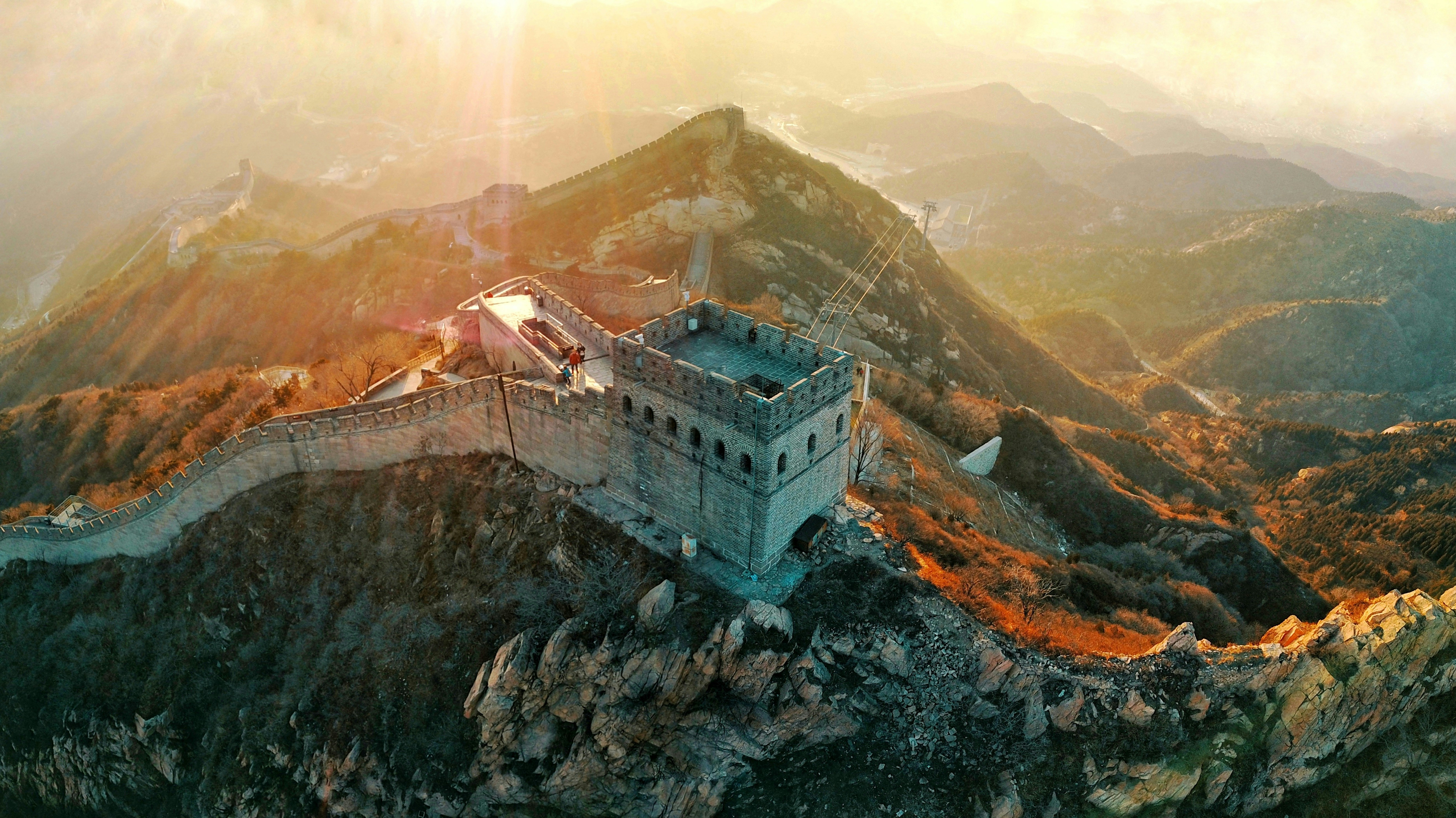The great wall of china on a misty mountain peak.