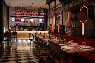 Modern restaurant interior with checkered floor and neon signs