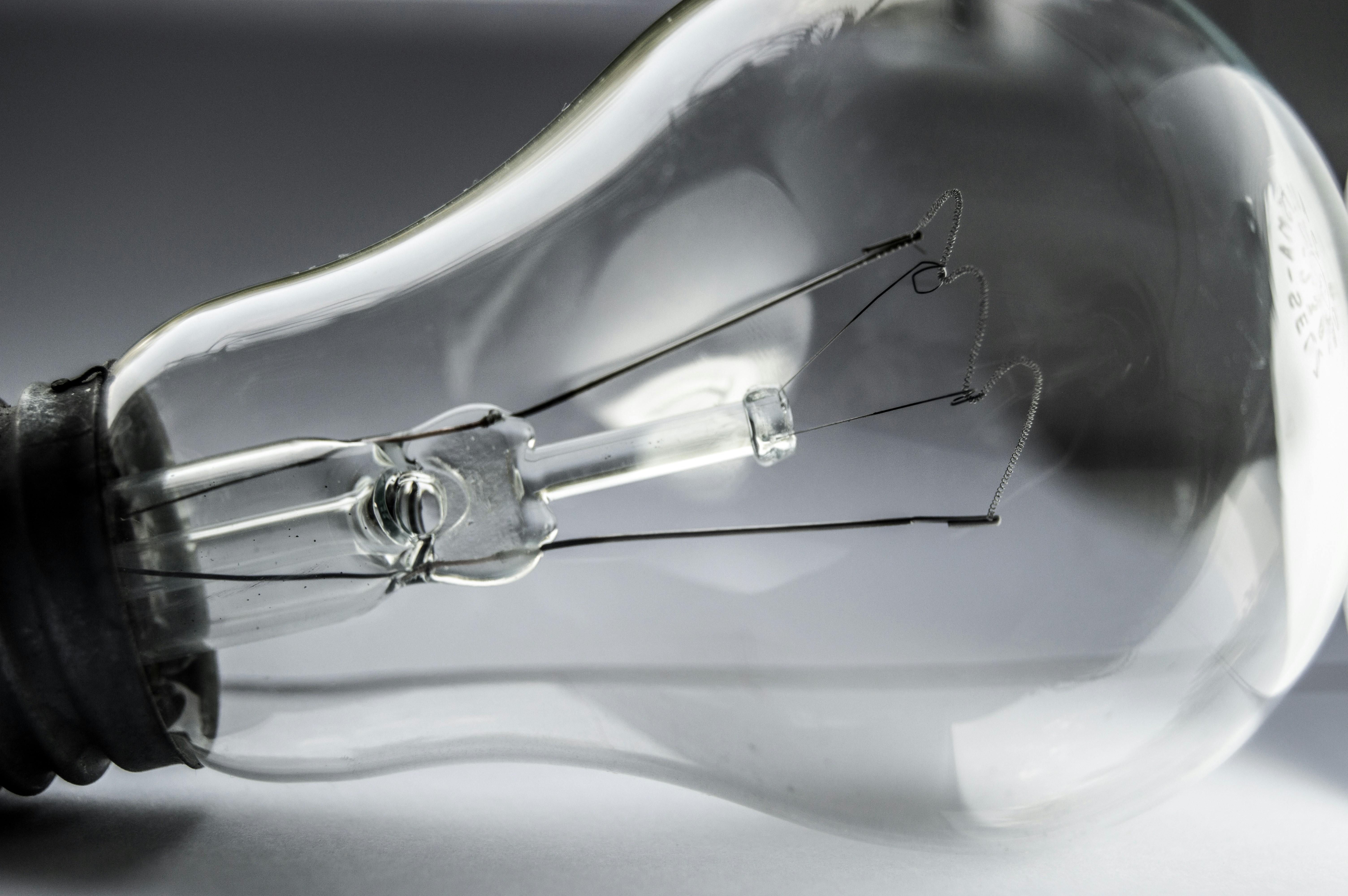 Close-up of a clear incandescent light bulb filament.