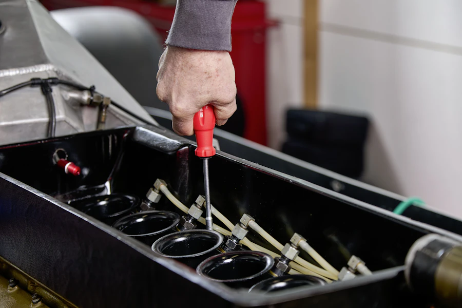 Mechanic tools and engine components in a workshop