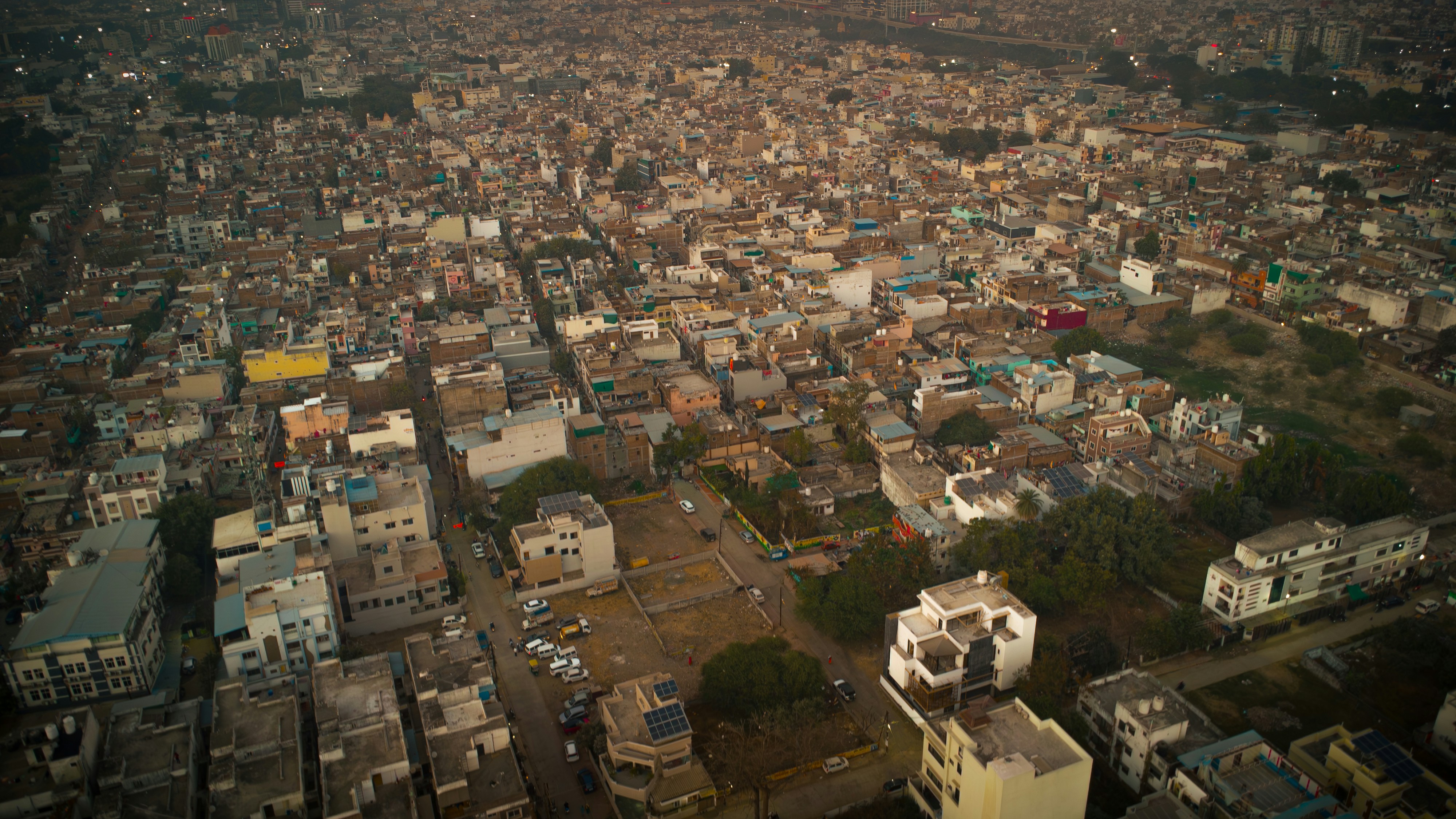 Aerial view of a dense urban city at dusk