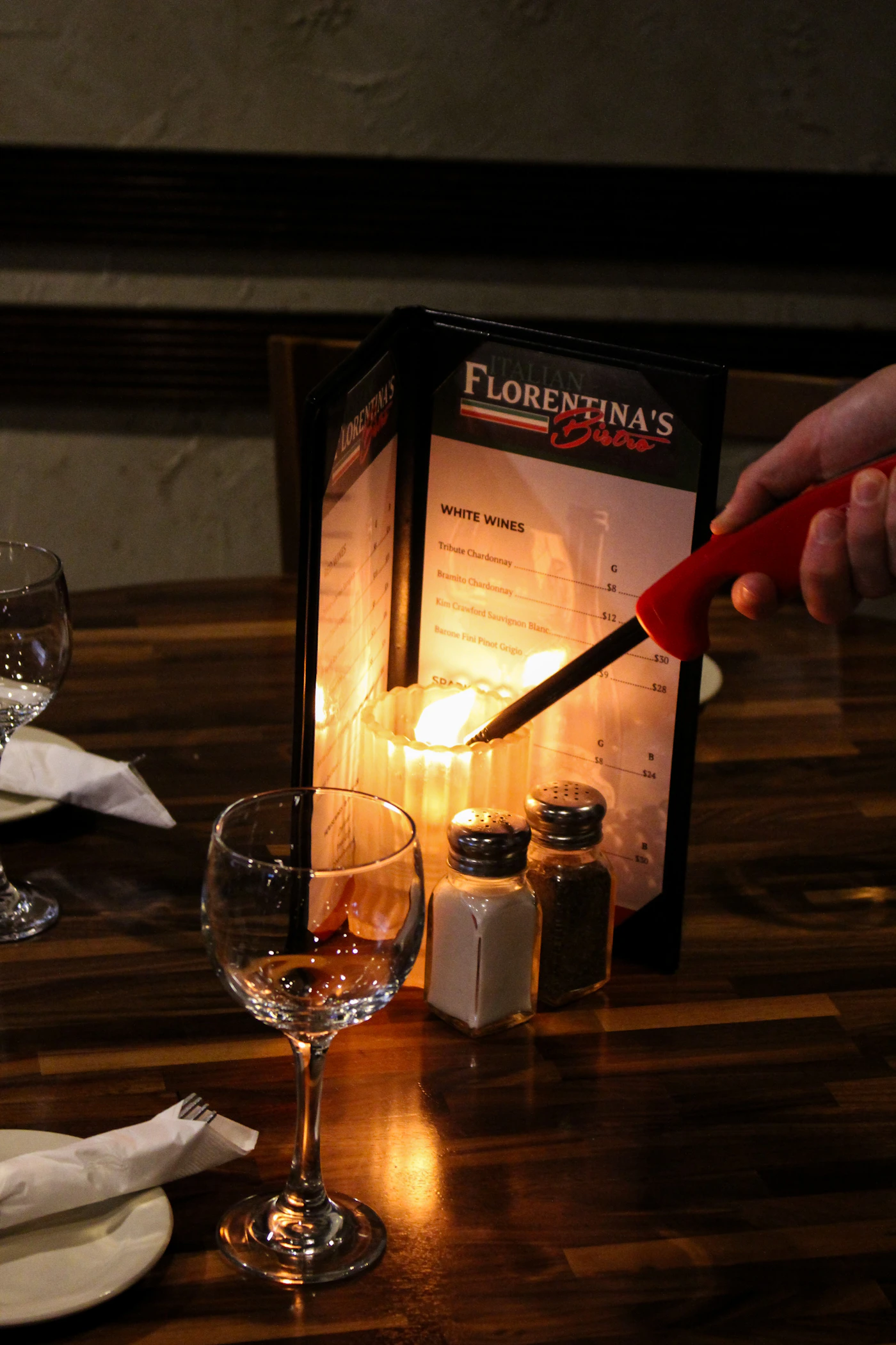Candle being lit for a romantic dinner