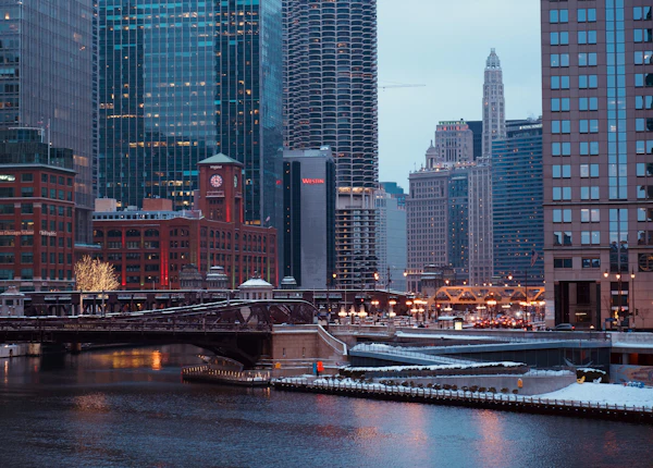 Chicago cityscape with skyscrapers and river at dusk