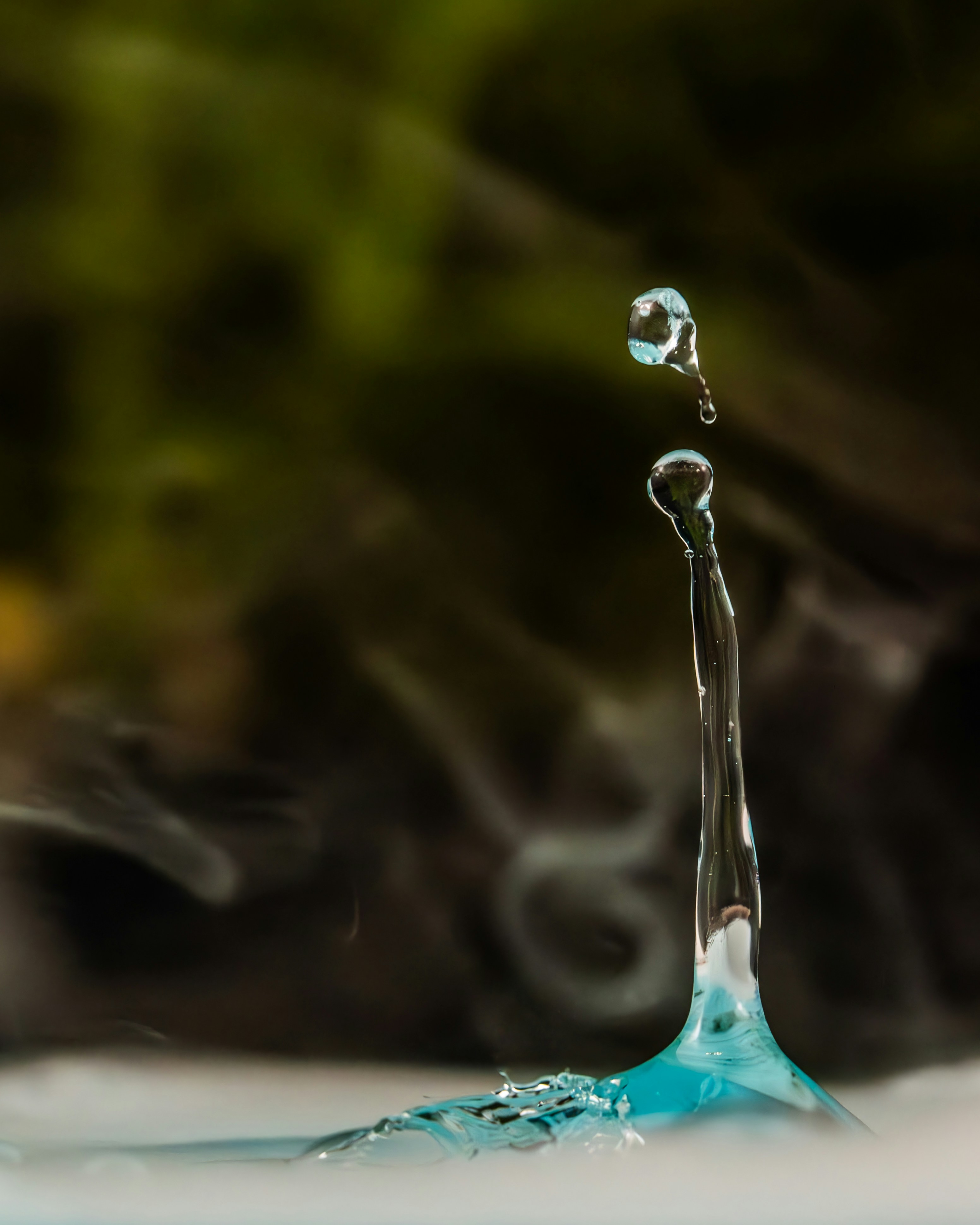 Water droplet splashing and forming a tower.