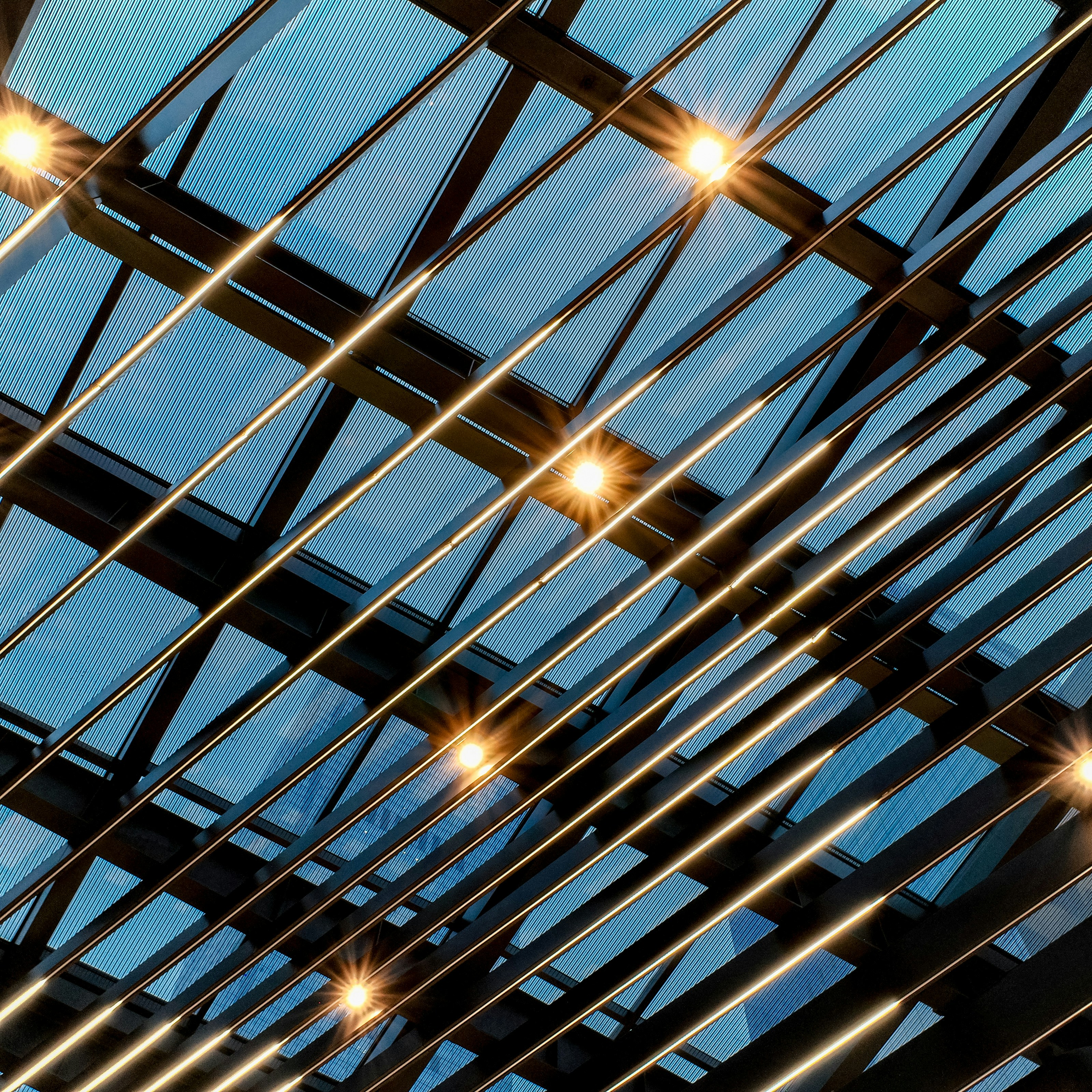 Modern ceiling with glass panels and lights