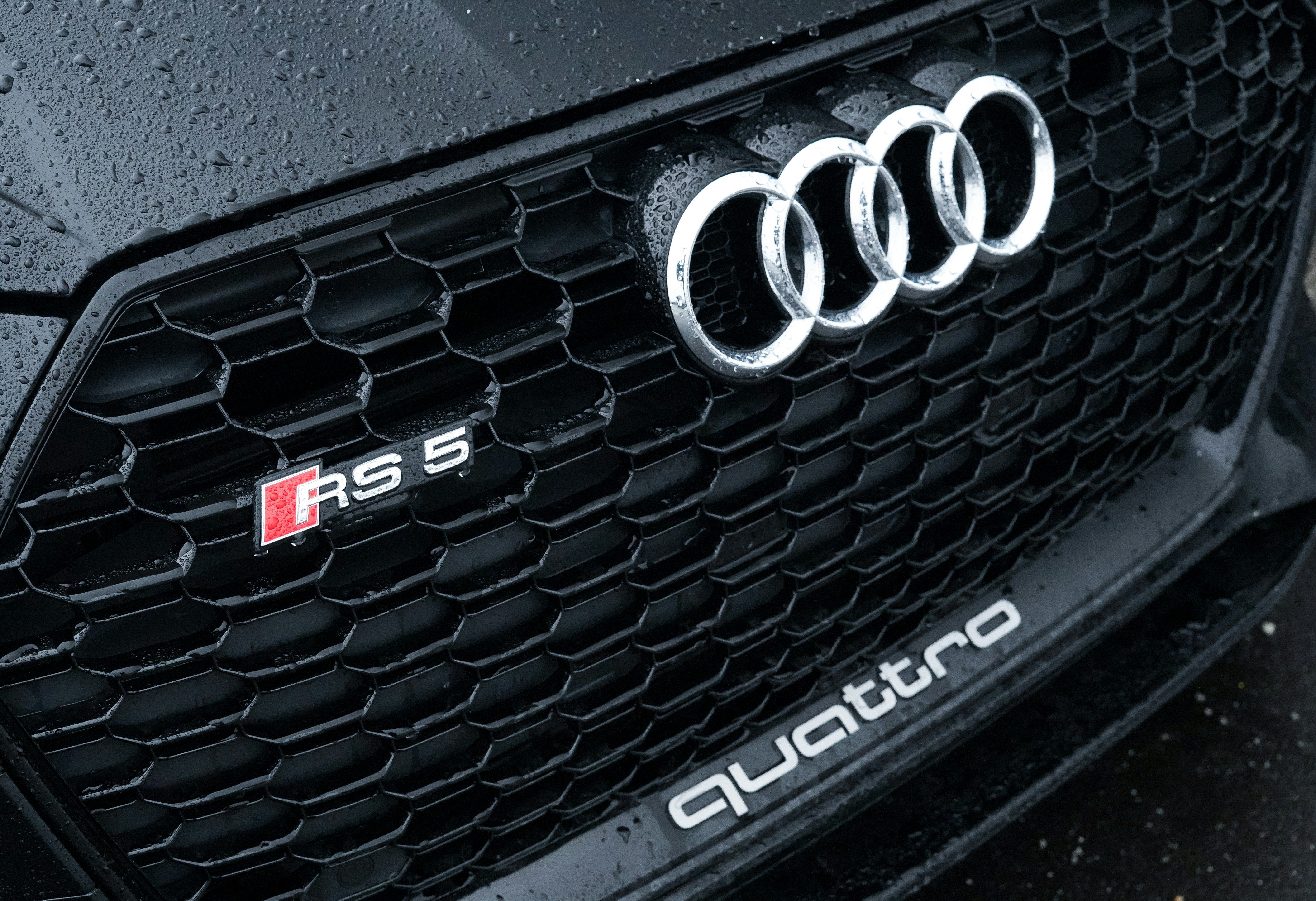 Close-up of a black audi rs5 quattro grille