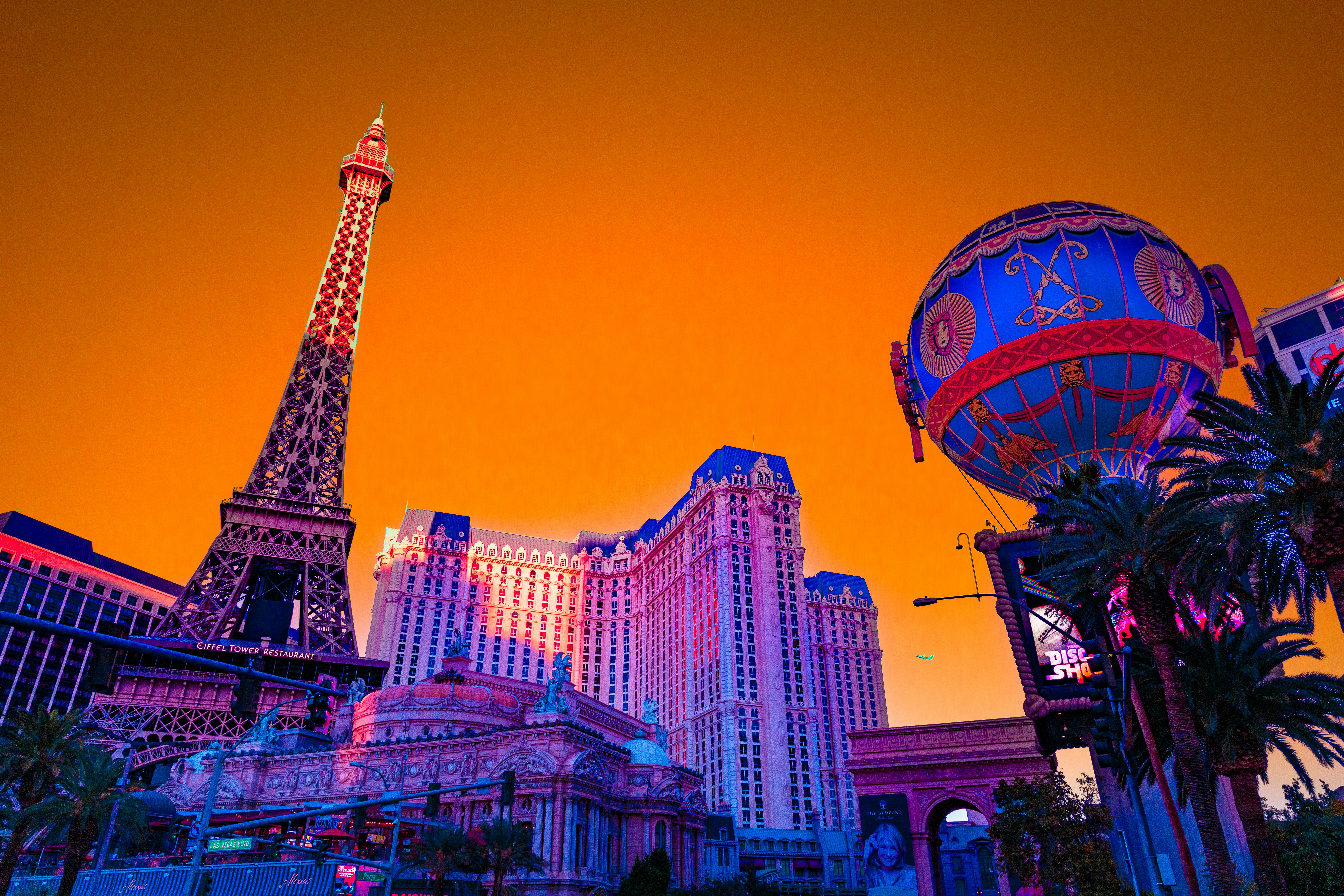 Las vegas strip hotels with eiffel tower replica at sunset