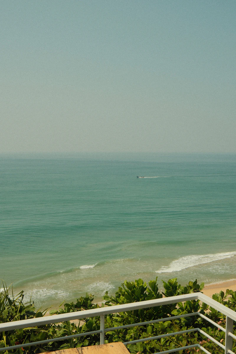 Oceanfront condo balcony with panoramic water views