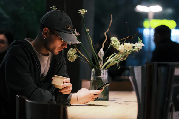 Customer ordering from their phone at a restaurant table