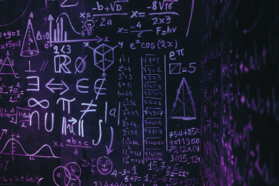 Blackboard with complex mathematical formulas and symbols.