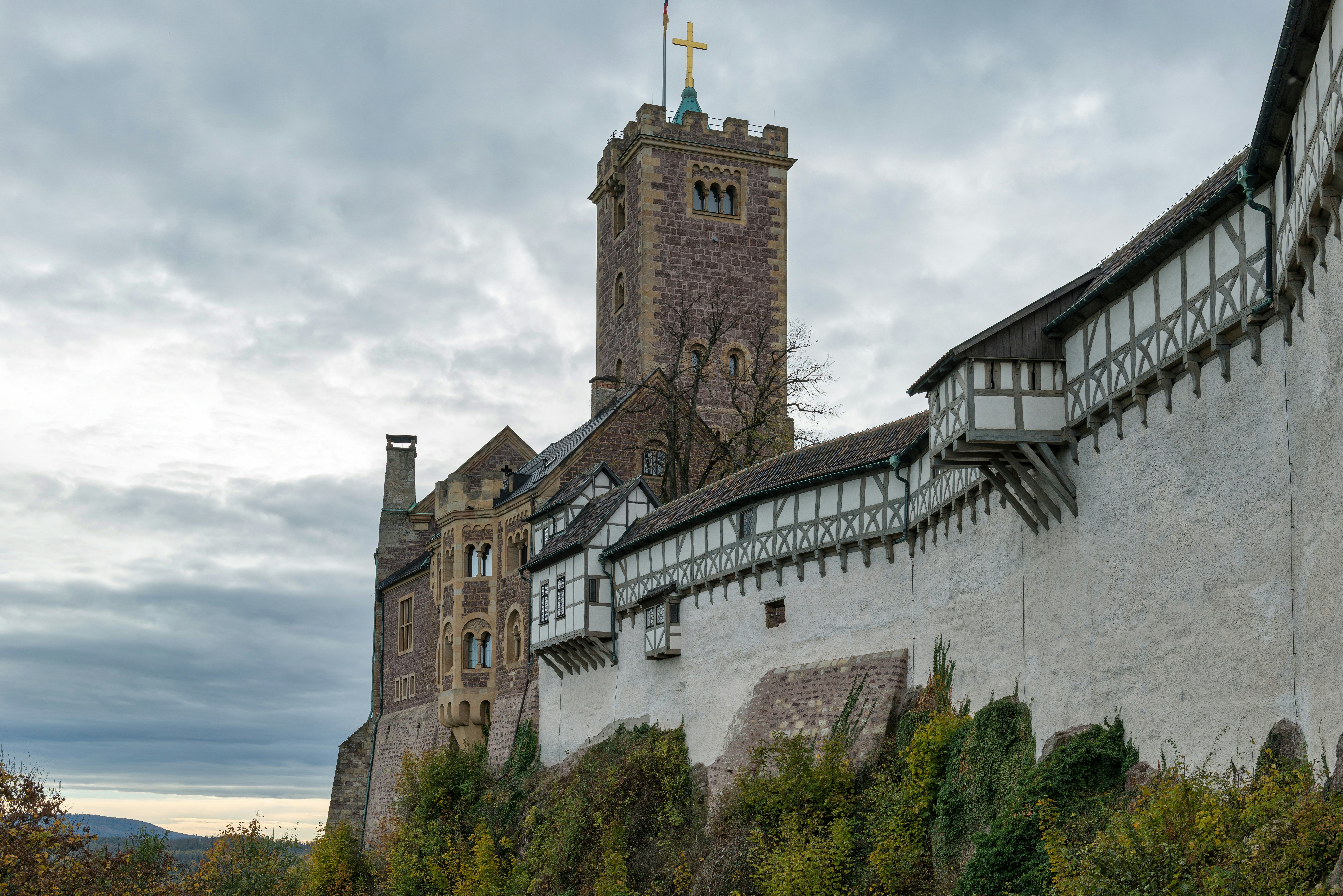 Historic castle with white walls and stone tower