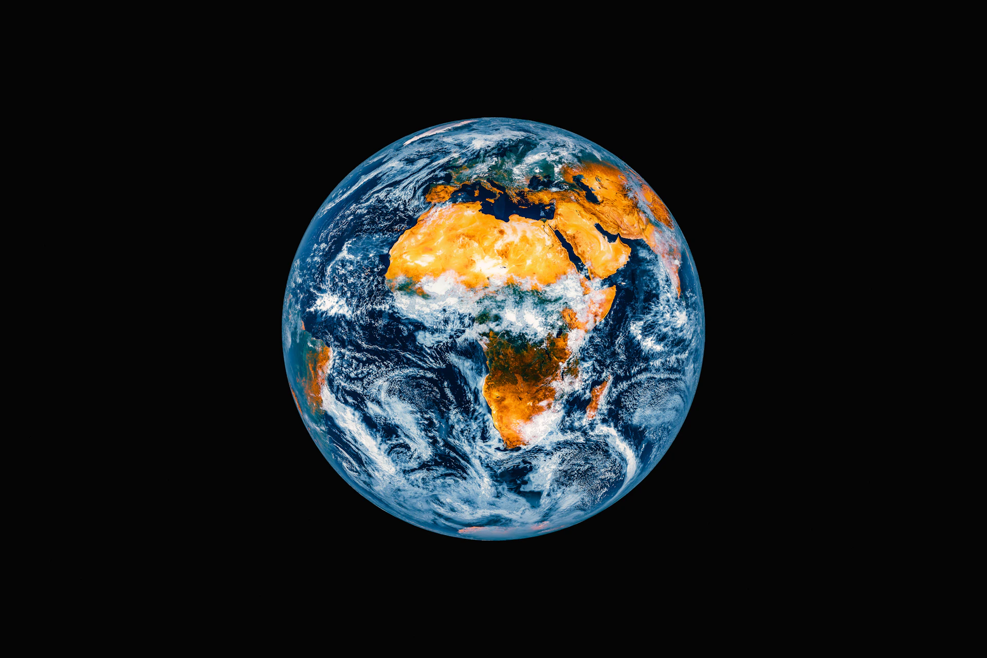 Planet earth seen from space with clouds and landmasses.
