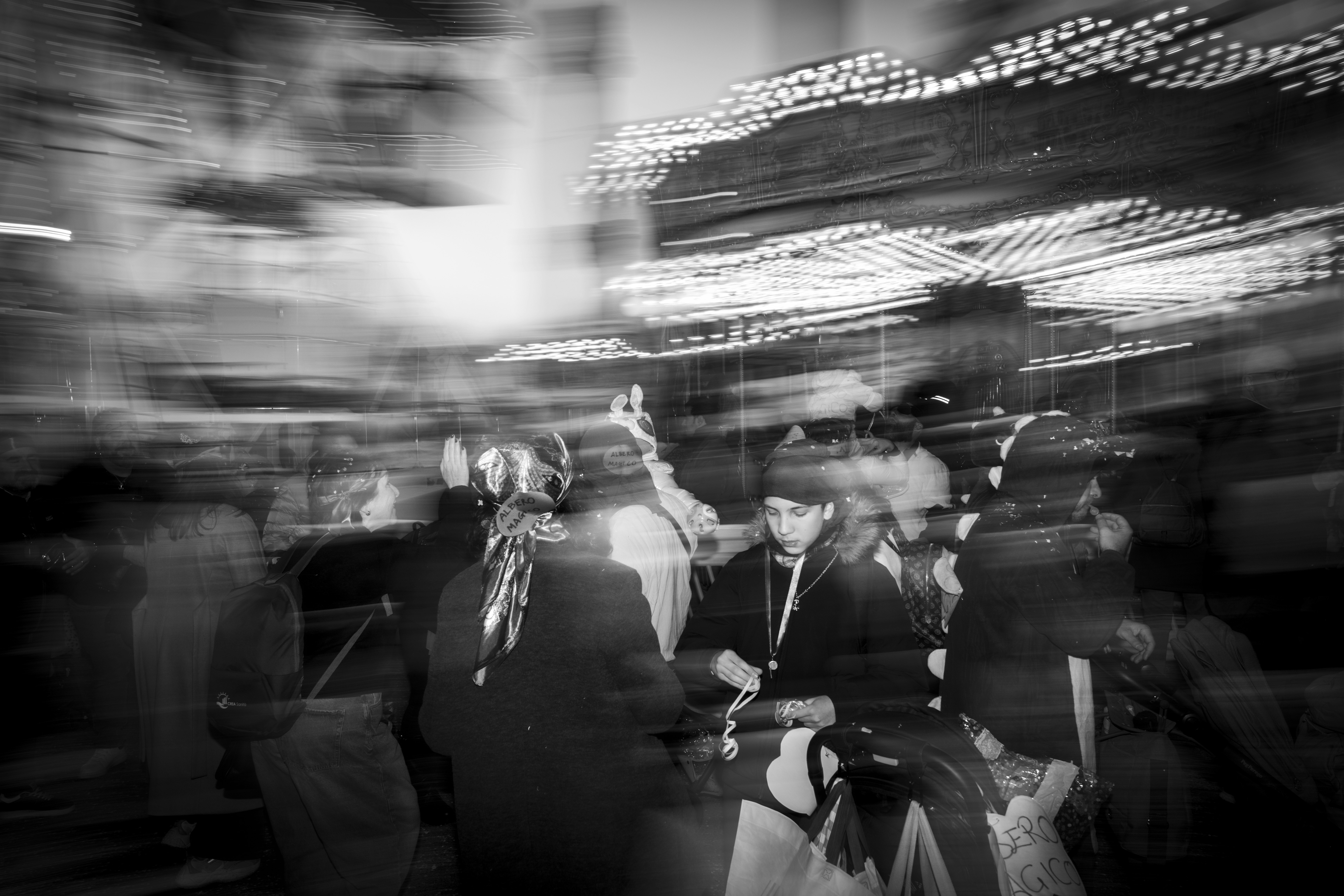 Blurred people in a busy urban setting at night