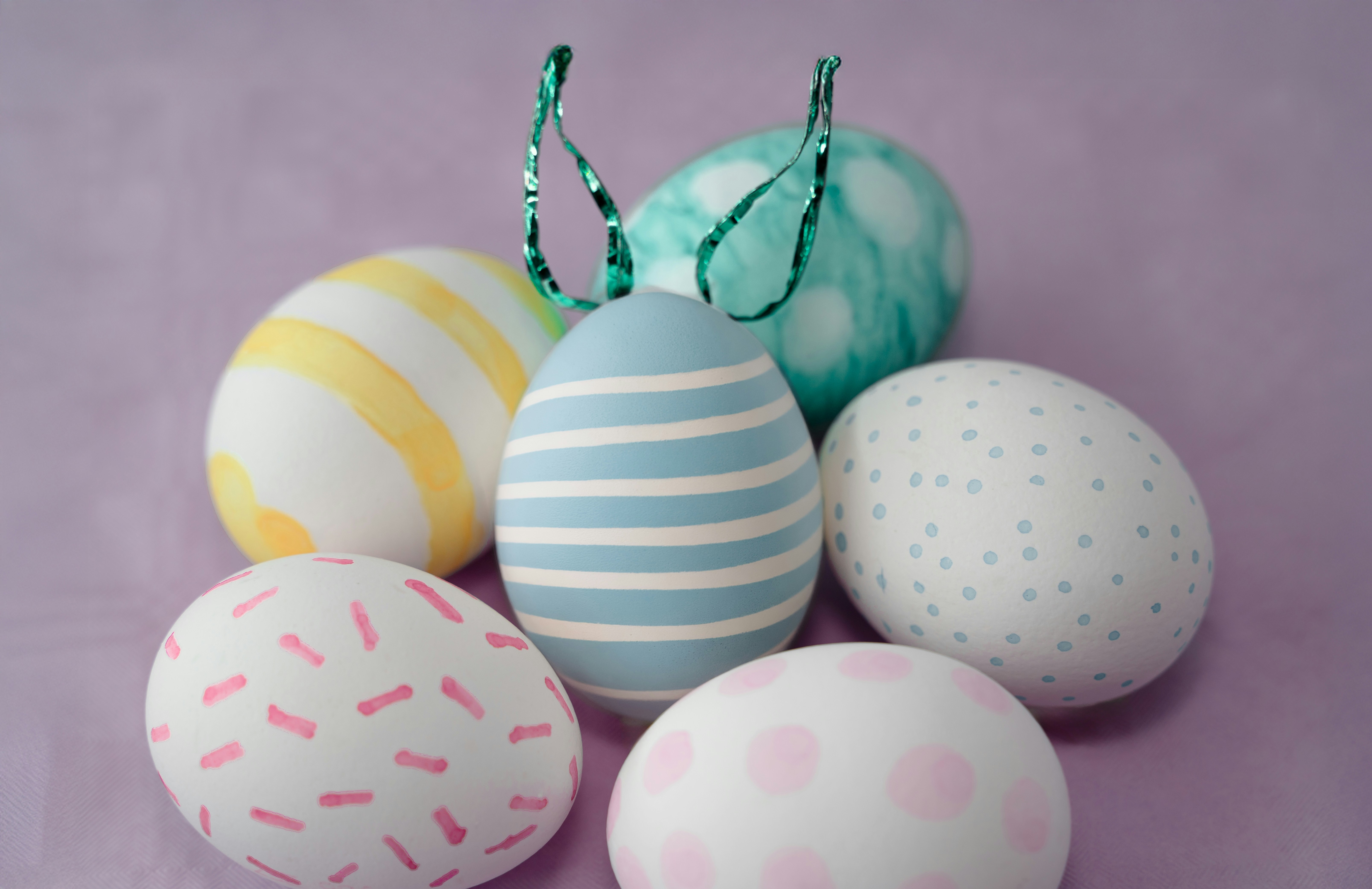 Decorated easter eggs in various pastel patterns.