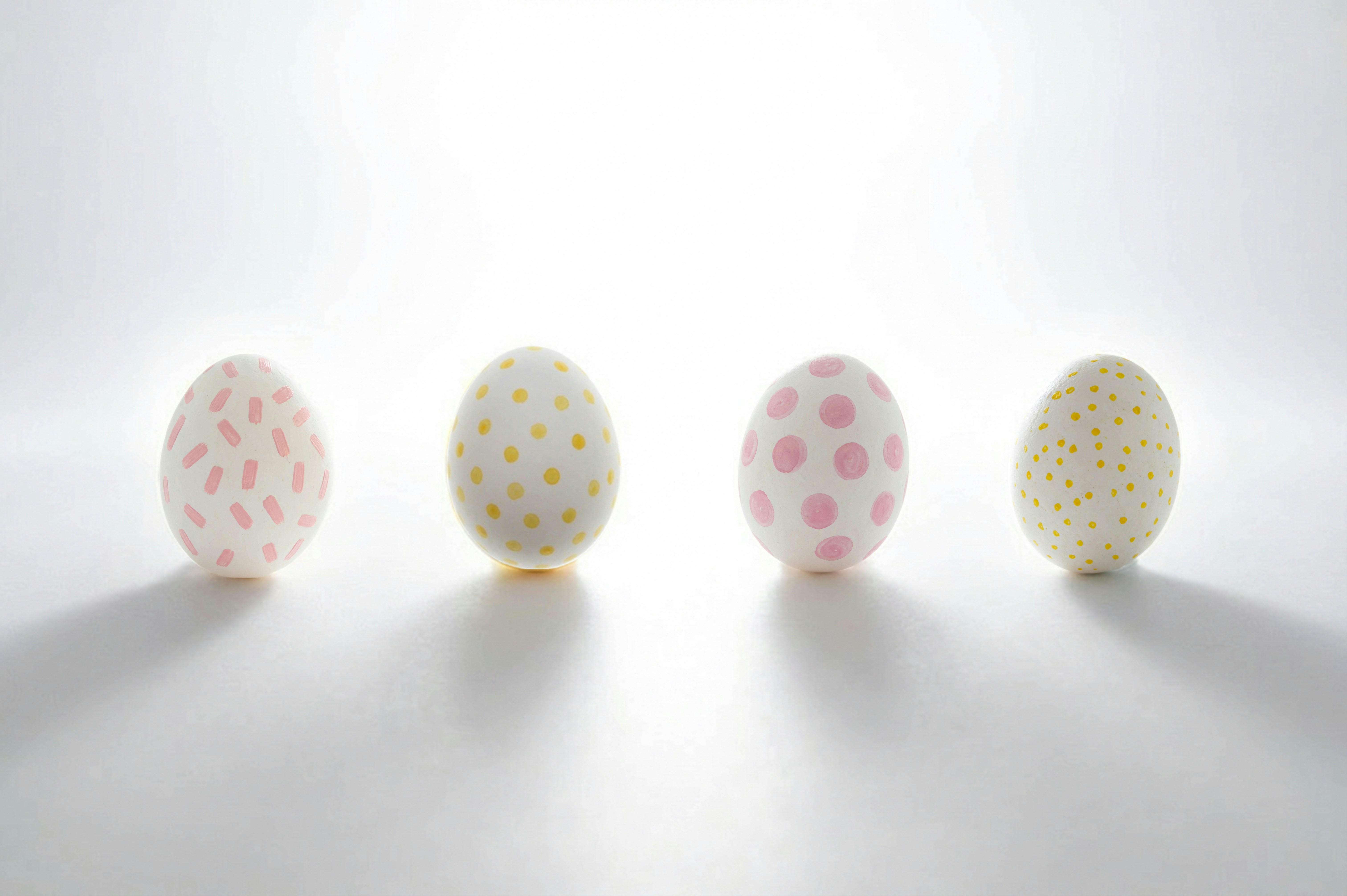 Four decorated easter eggs in a row