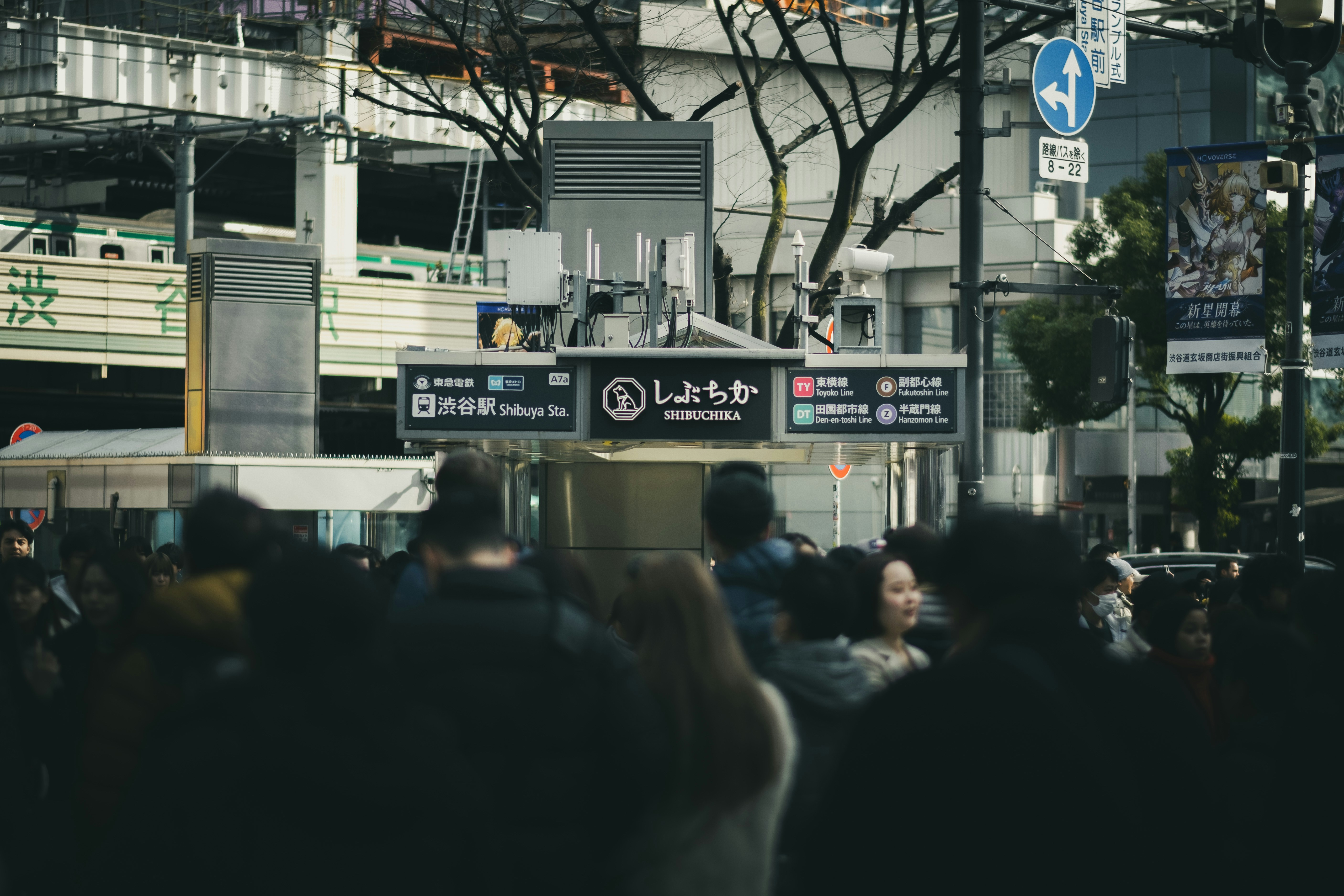 Crowded street with signs in japanese characters.