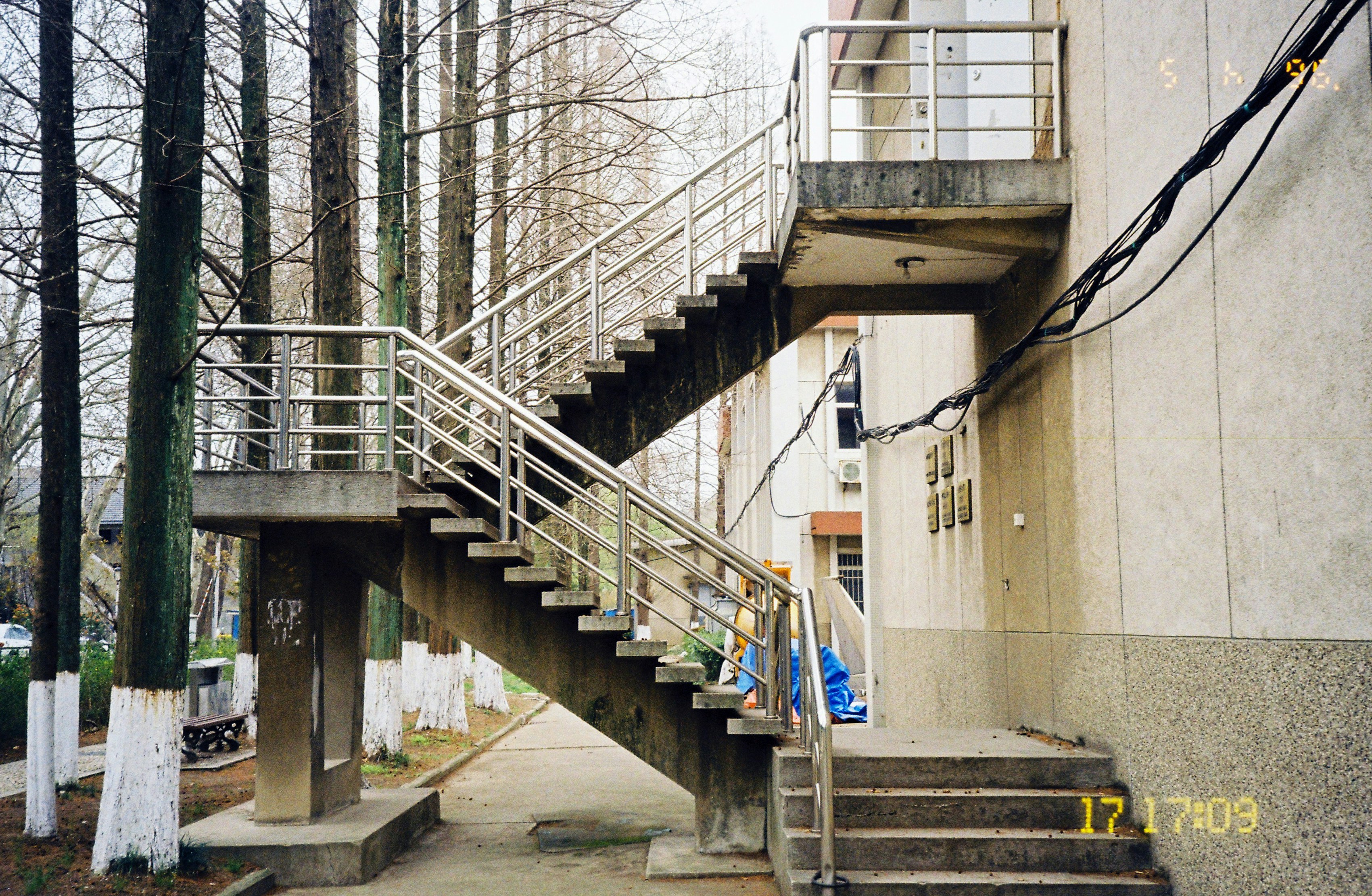 Outdoor metal staircase attached to building