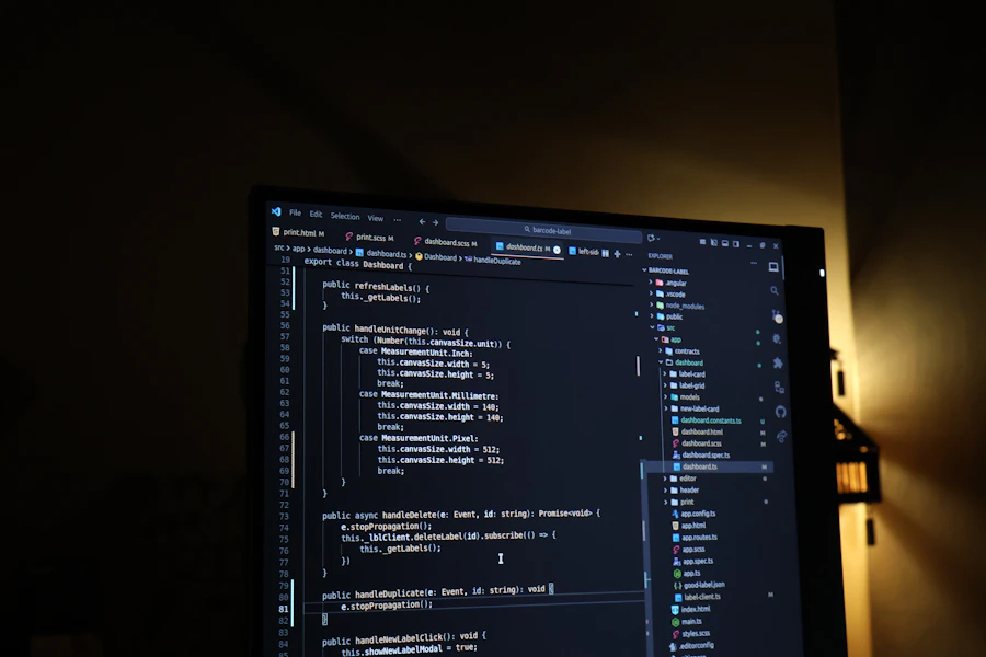 Computer screen displaying code in dark mode with warm ambient lighting