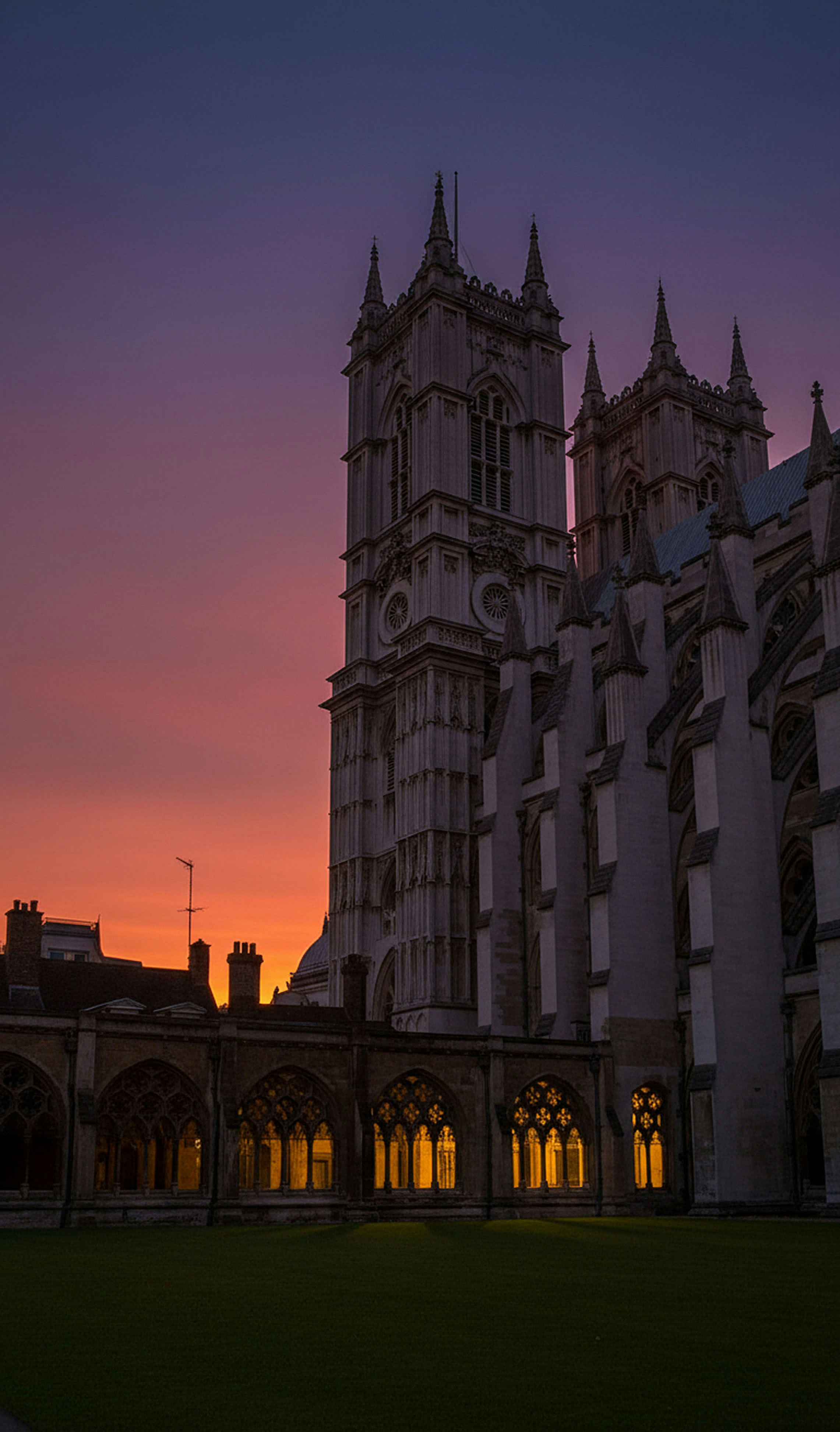 Gothic architecture against a vibrant sunset sky.