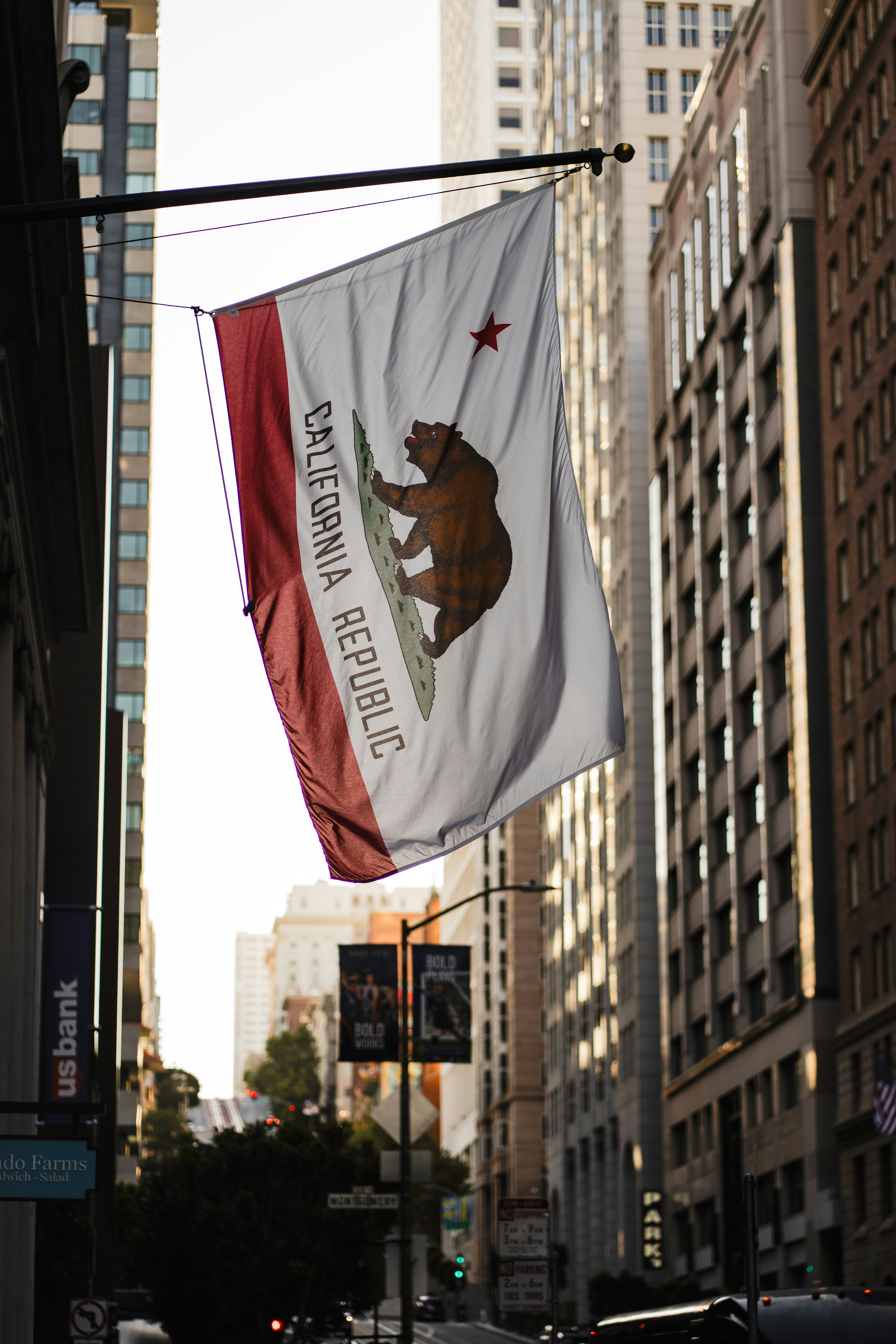 California flag waving on a city street