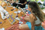 People painting outdoors at an art class.