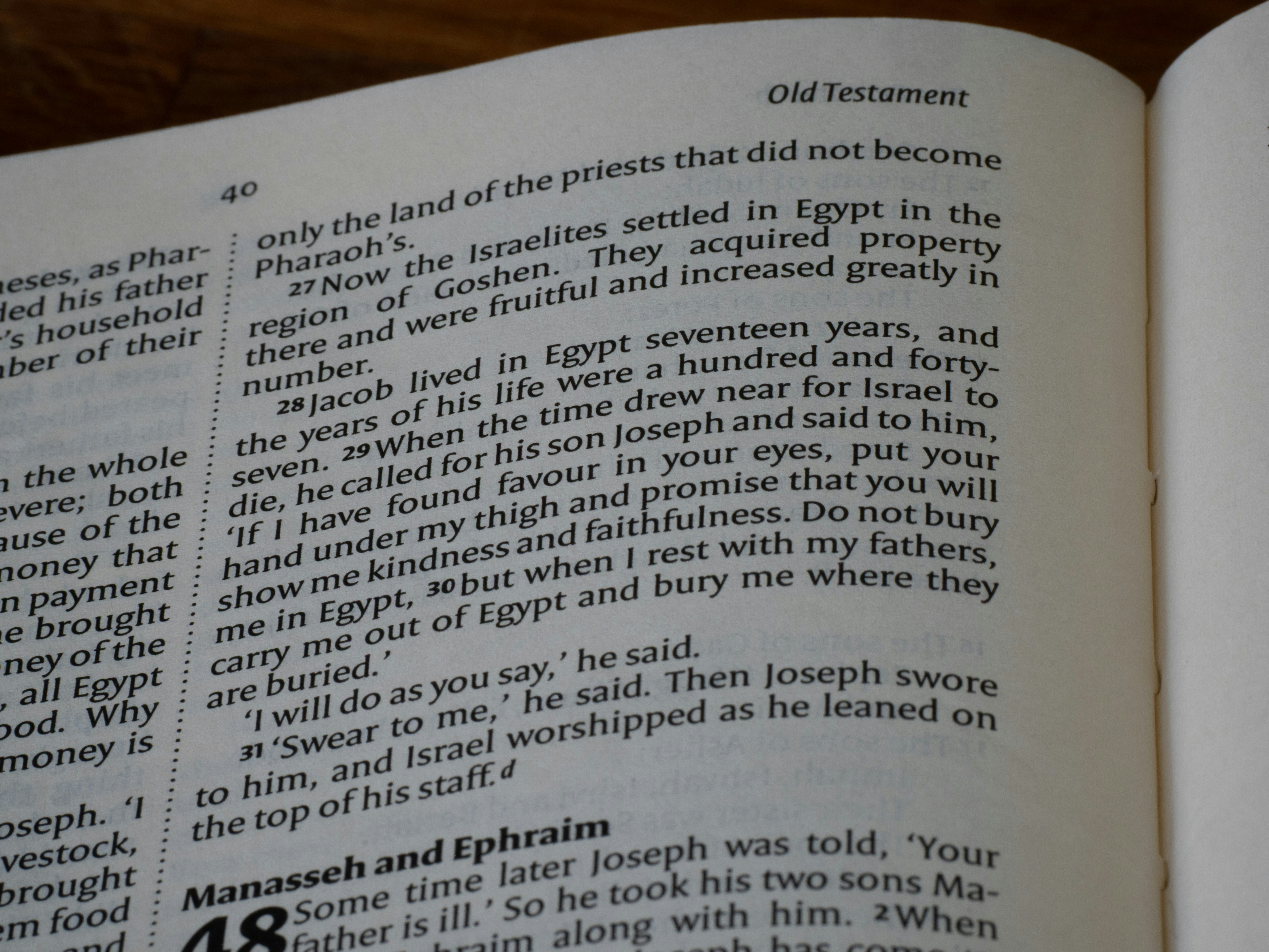 Close-up of an open book with text on pages.