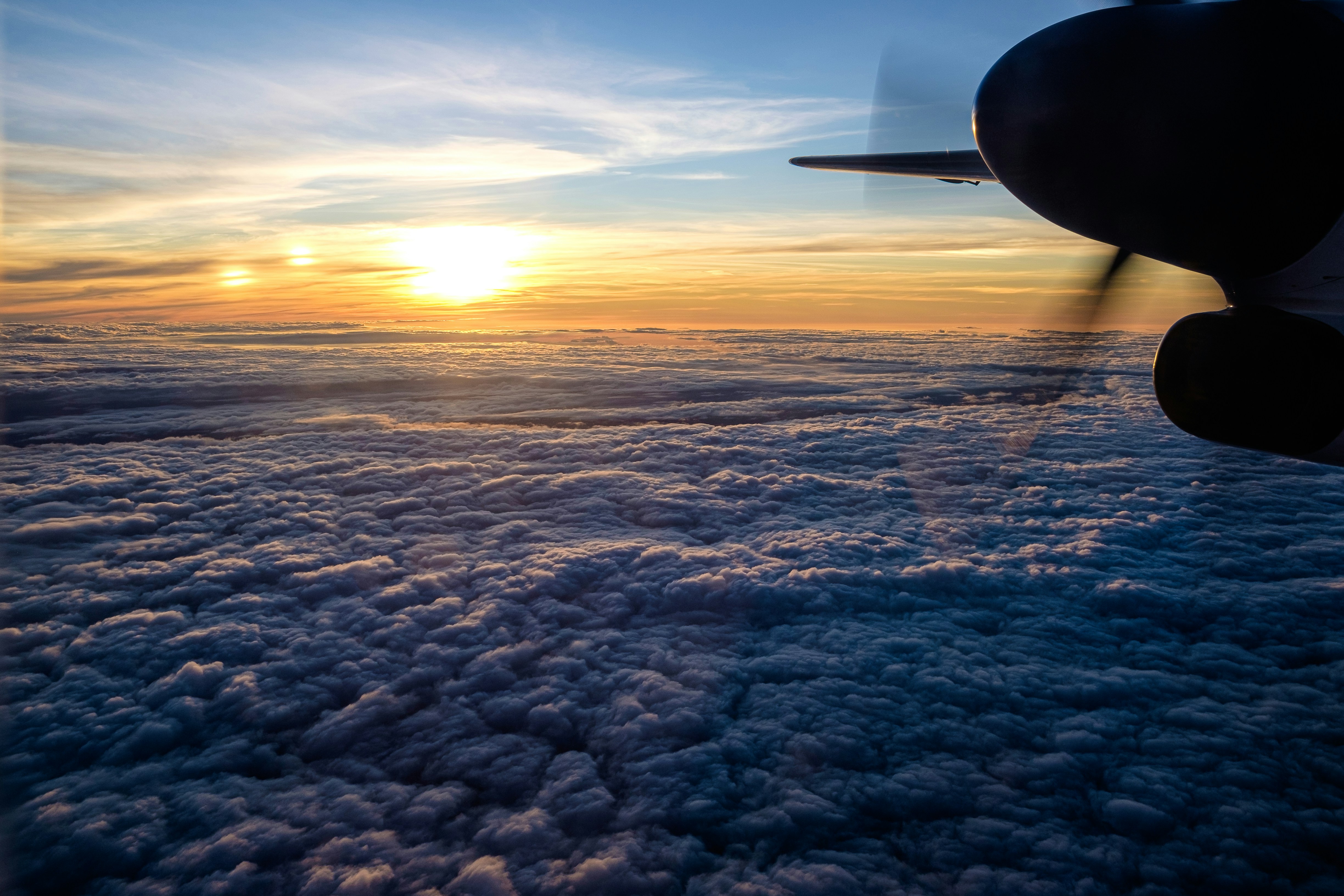 Sunrise over clouds seen from an airplane