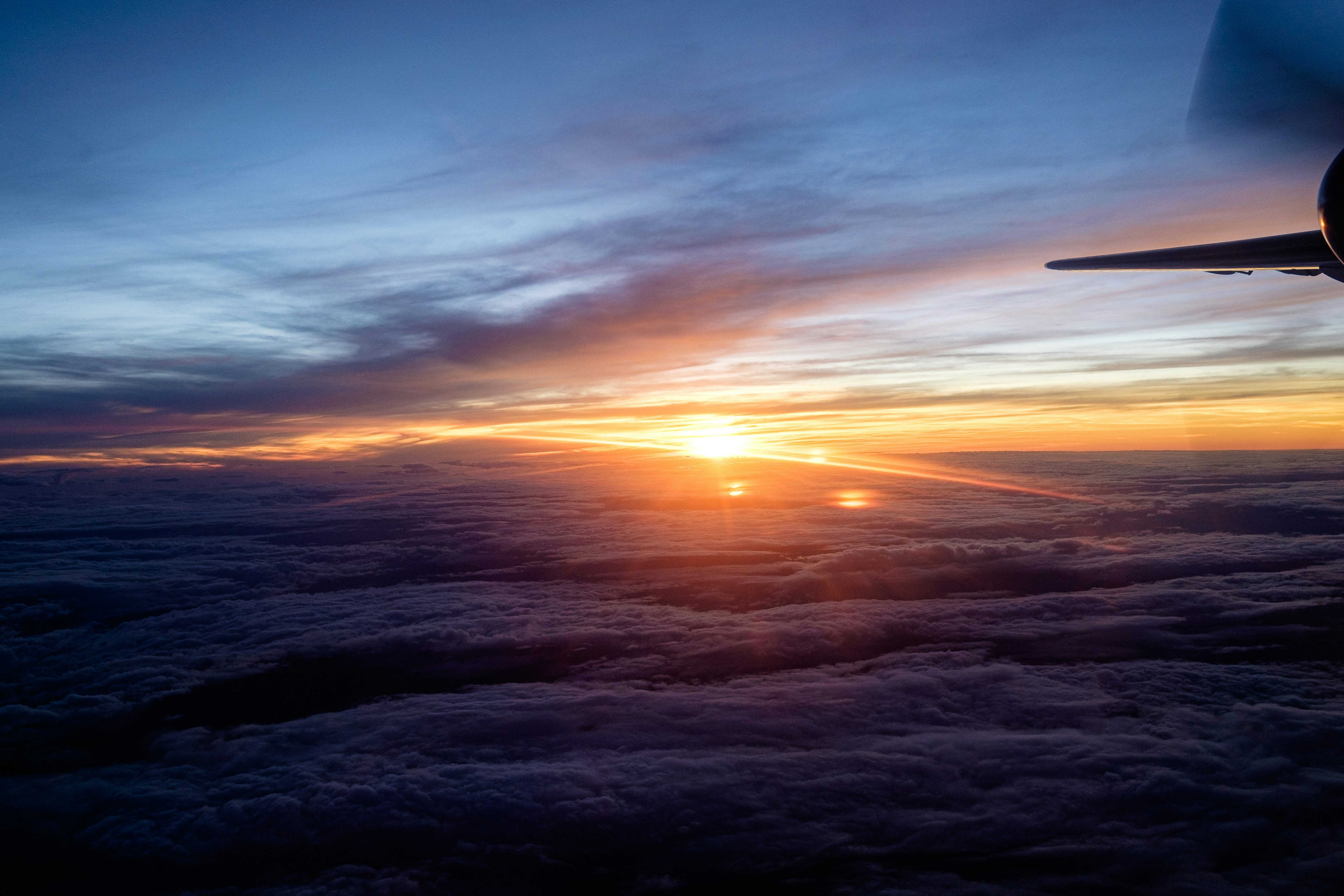 Sunrise over clouds seen from airplane