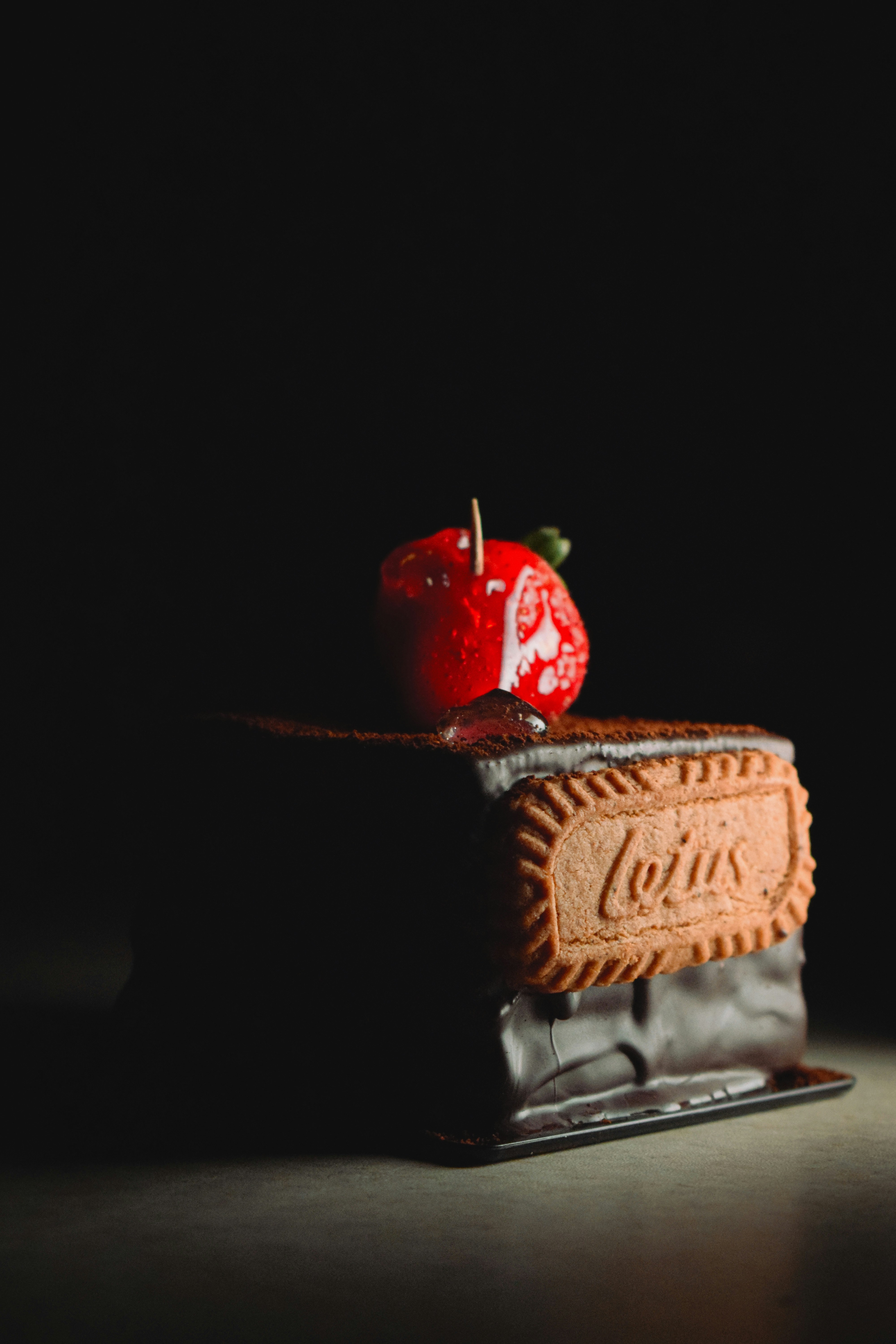 Chocolate cake with strawberry and cookie decoration