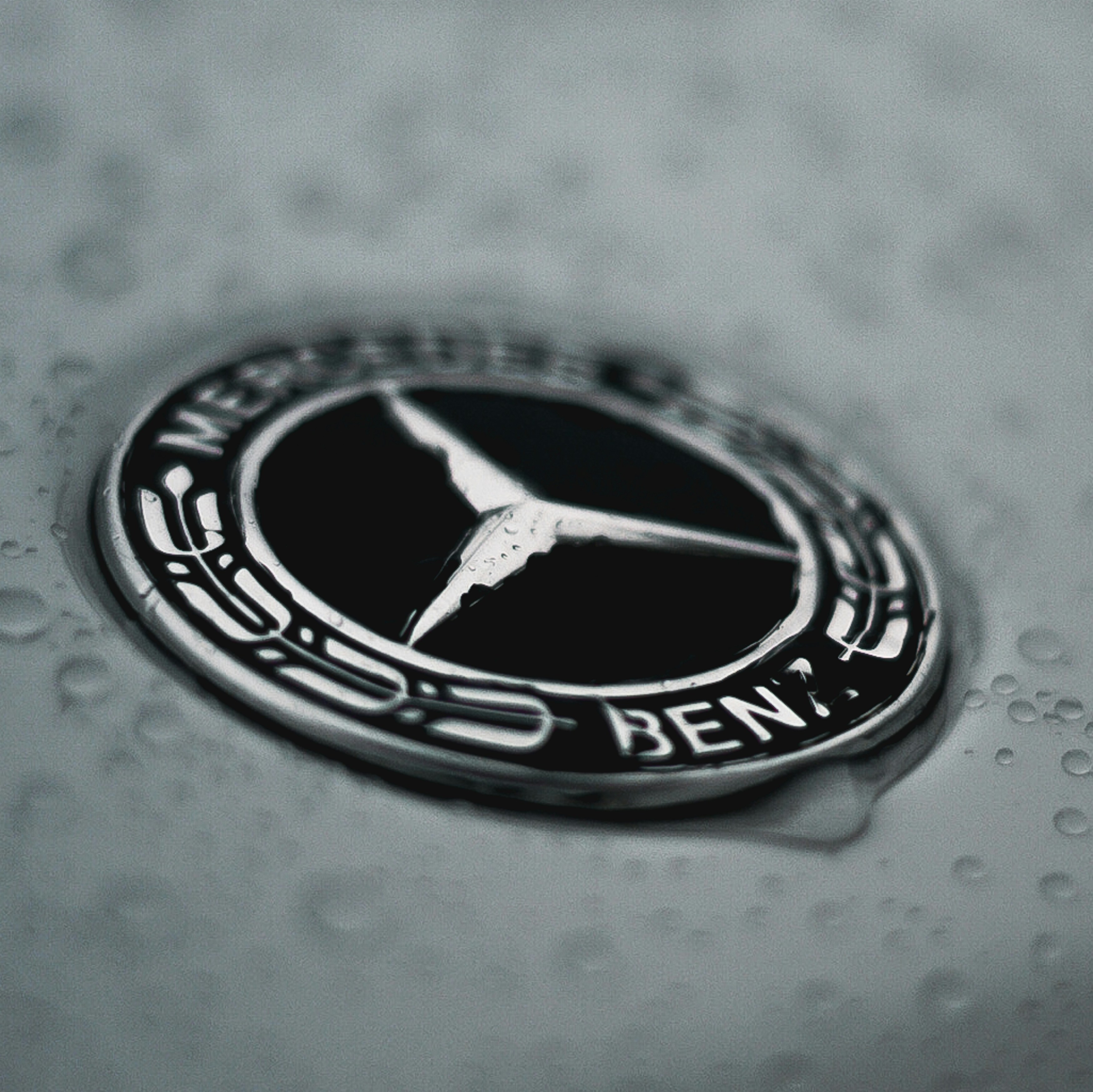 Mercedes-benz logo with water droplets