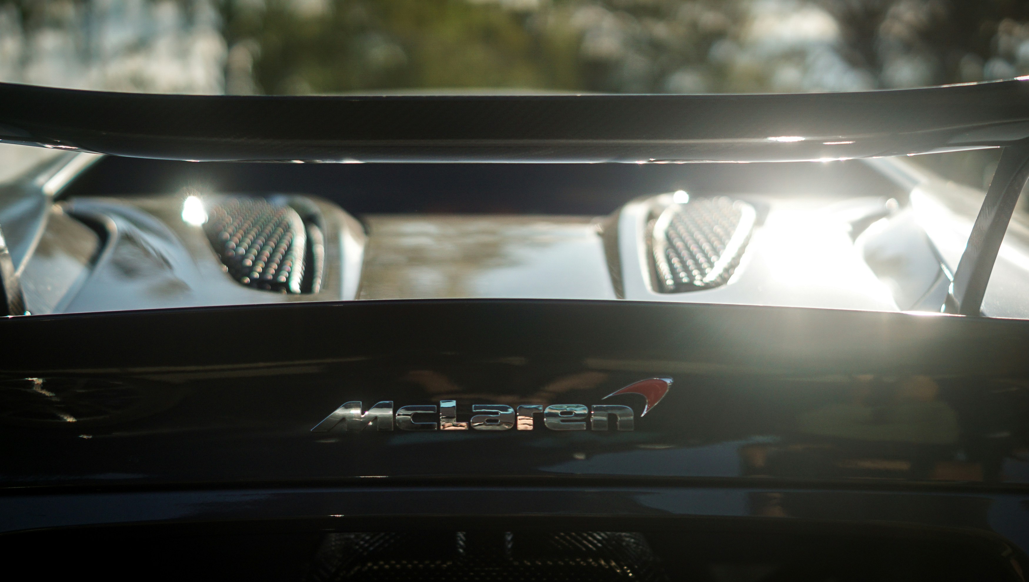 Close-up of a luxury sports car's rear spoiler