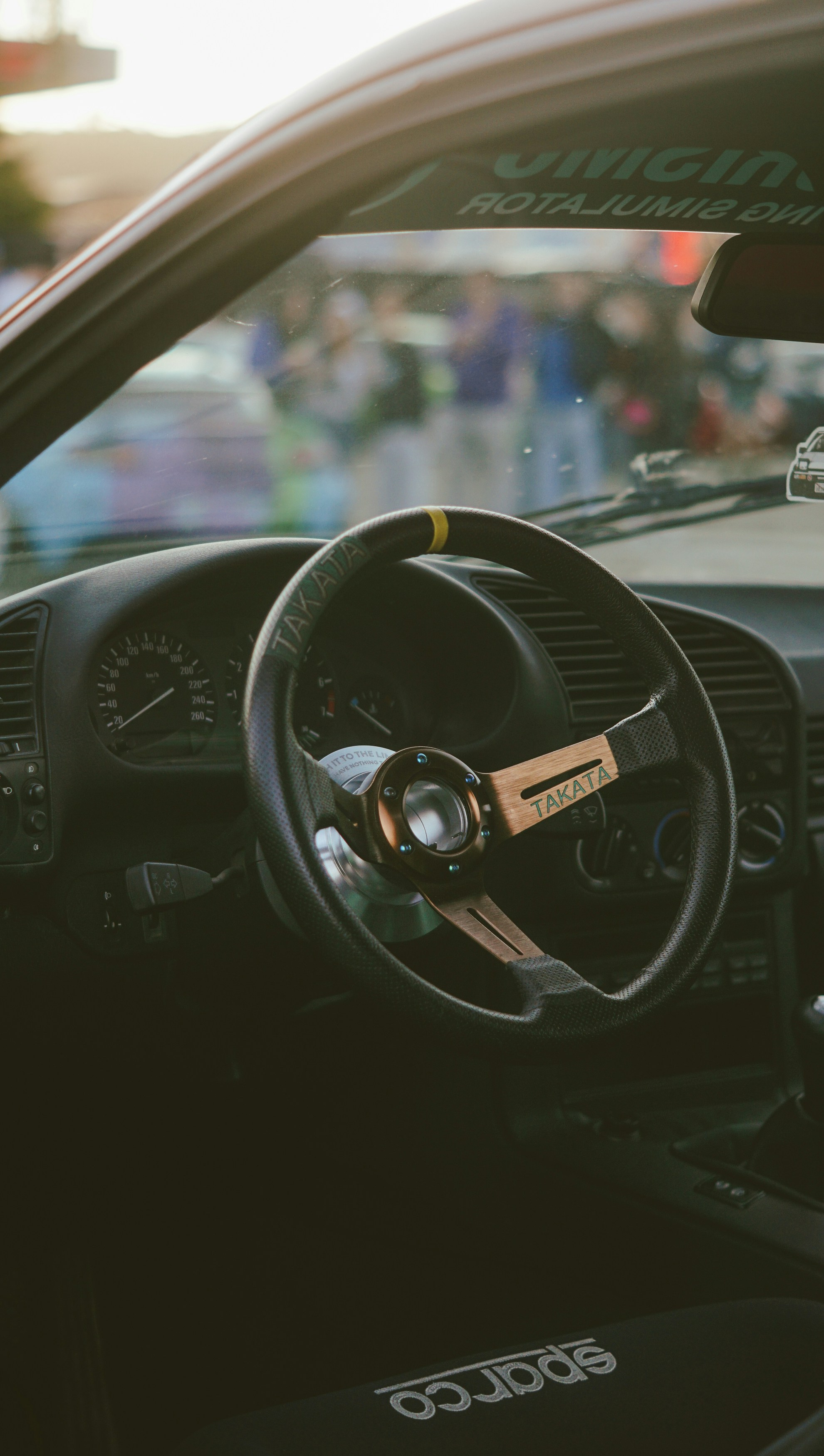 Interior of a car with a takata steering wheel.