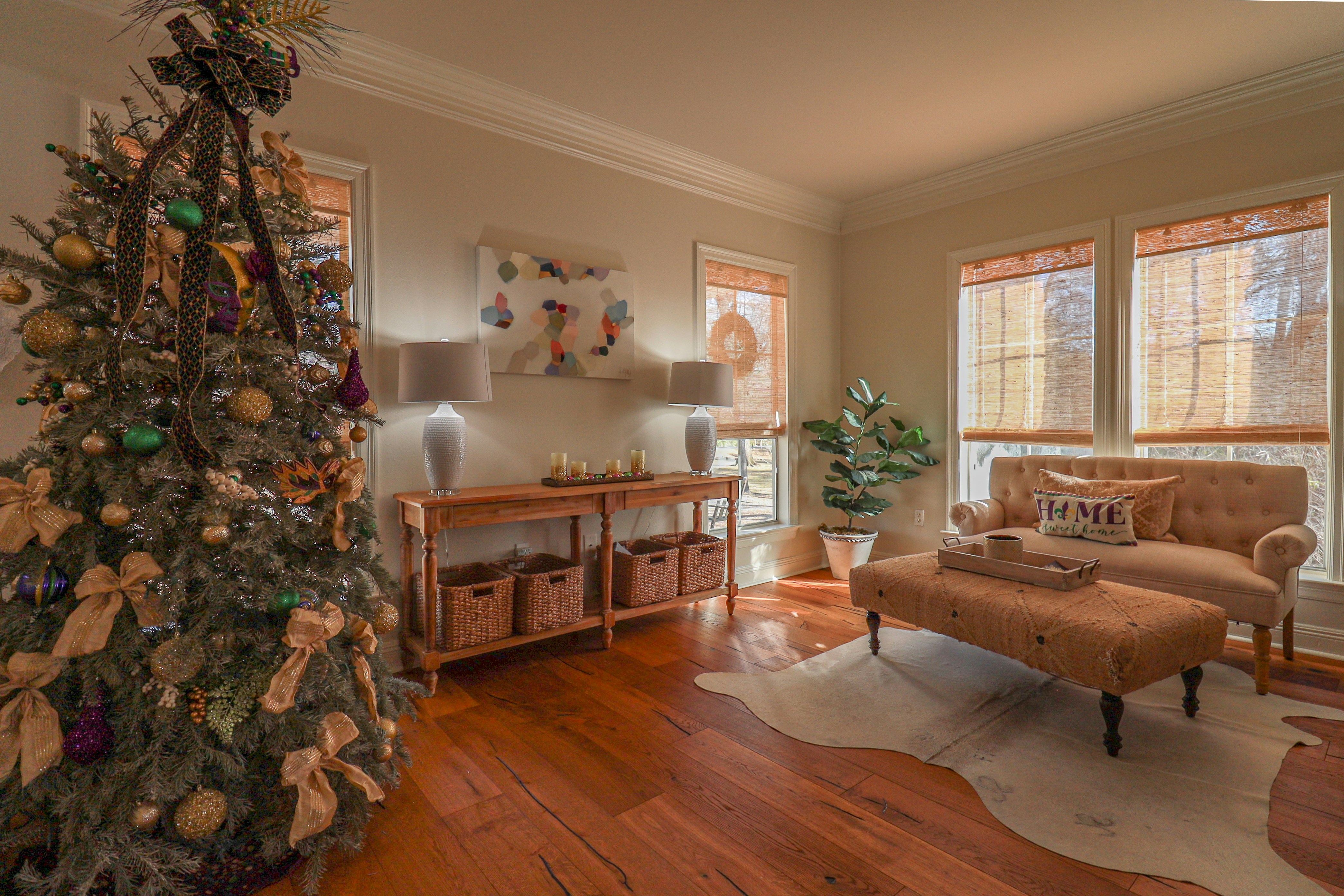 A decorated christmas tree in a cozy living room.