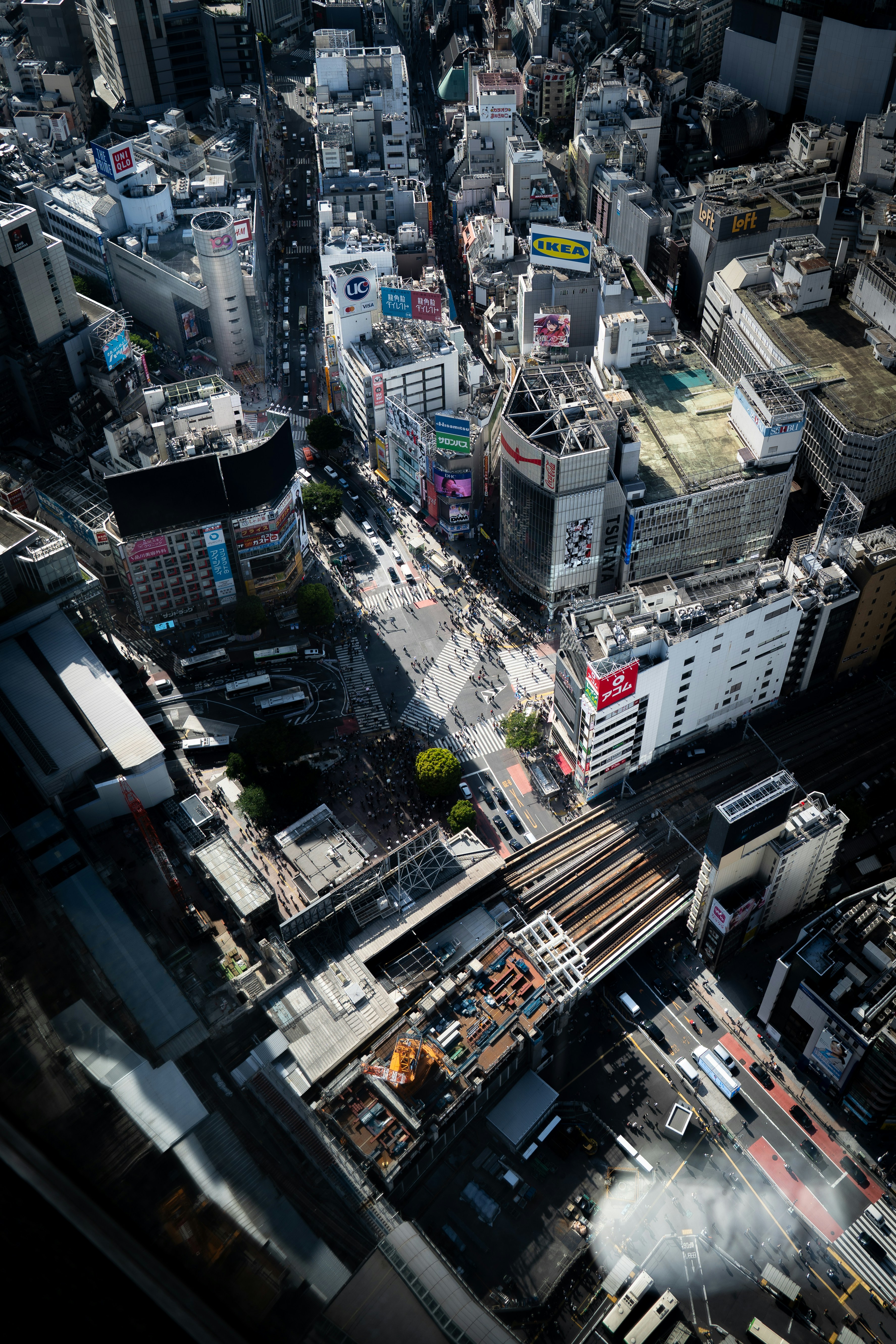 Aerial view of a bustling city street with many buildings.
