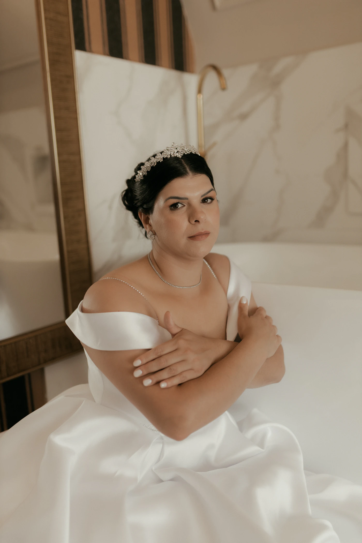 How to remove stains from a satin wedding gown — A close-up of a professional wedding dress cleaning tag on a hanging gown.