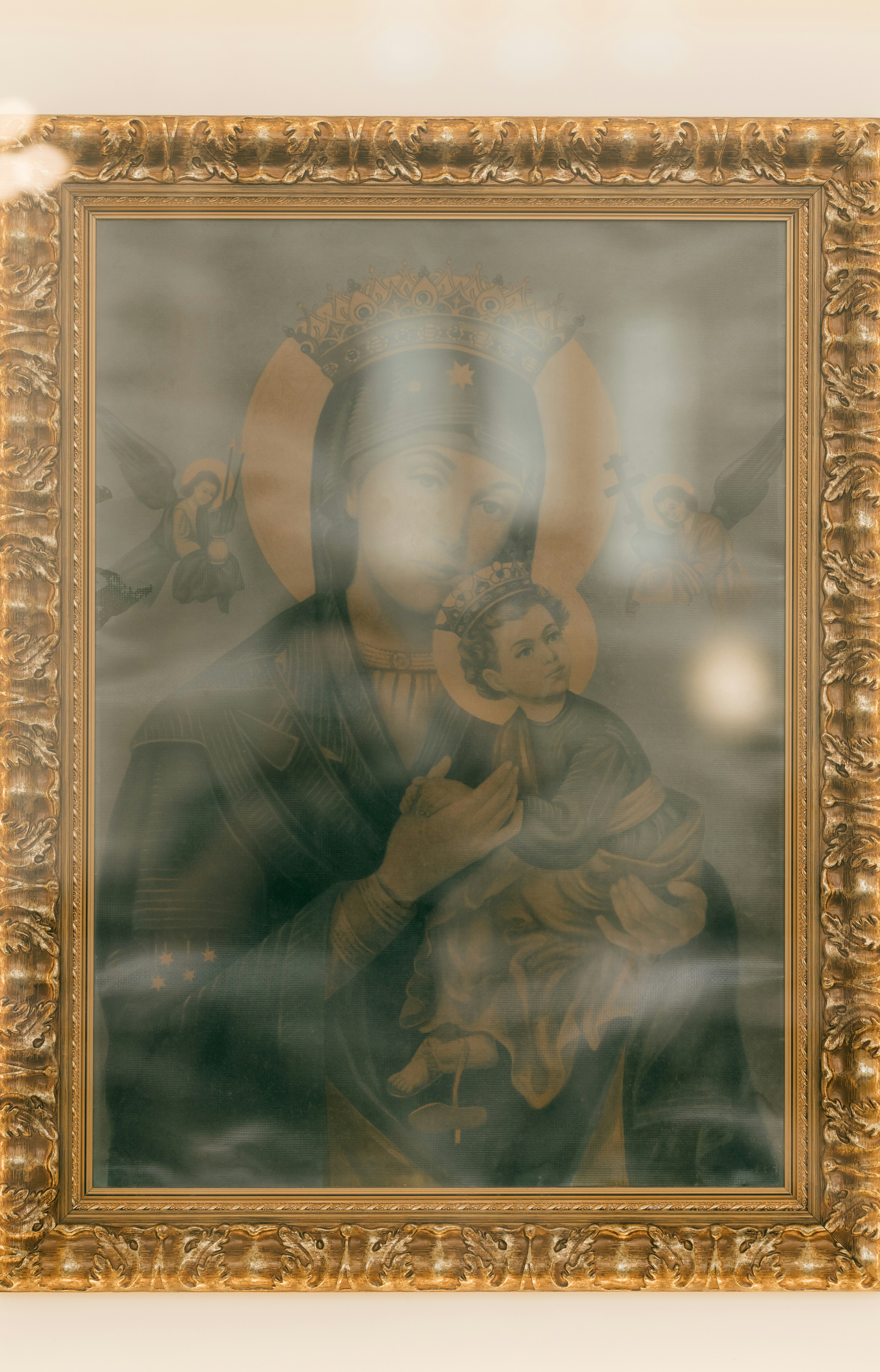 Framed religious painting of madonna and child