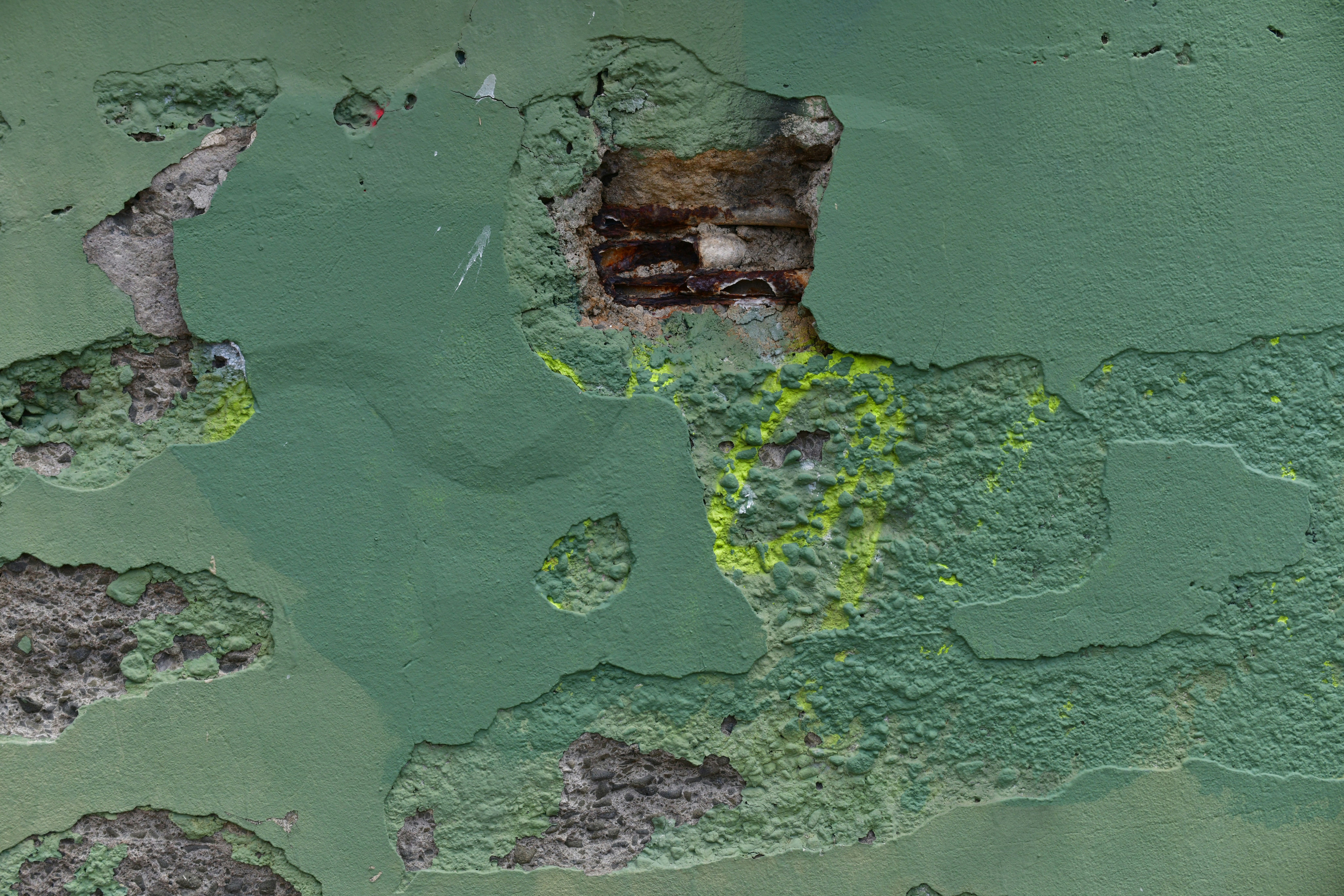 Abstract green and brown textured surface with organic shapes