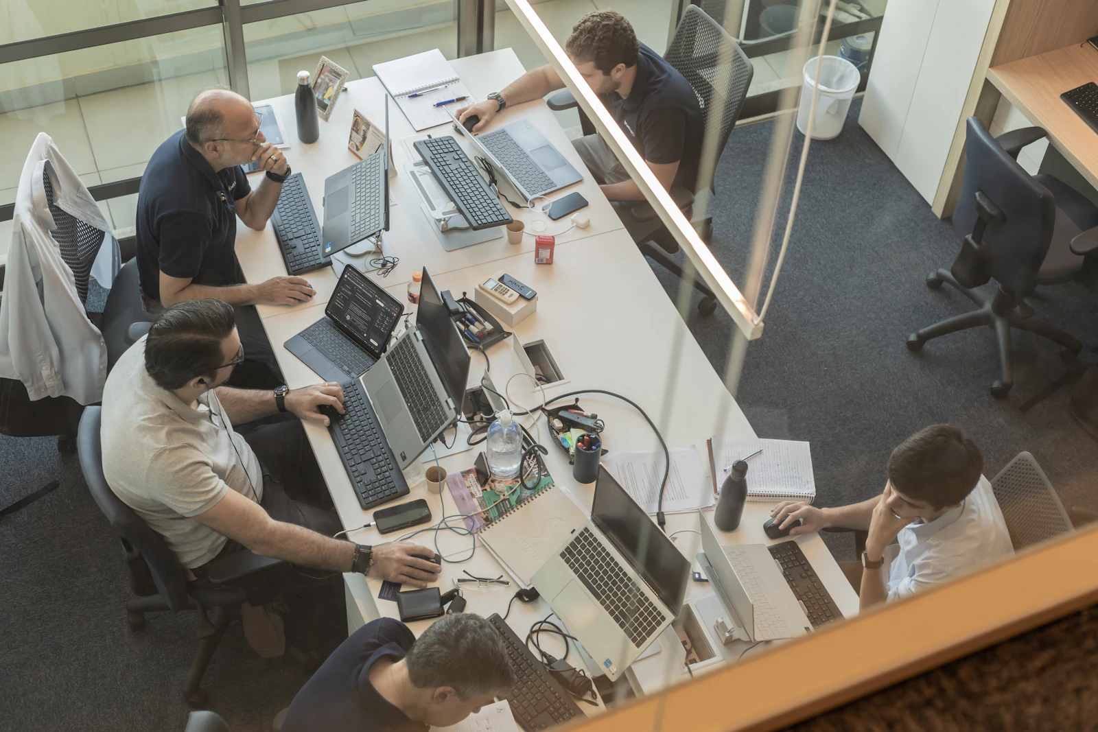 A modern office team working at computers on business technology tasks