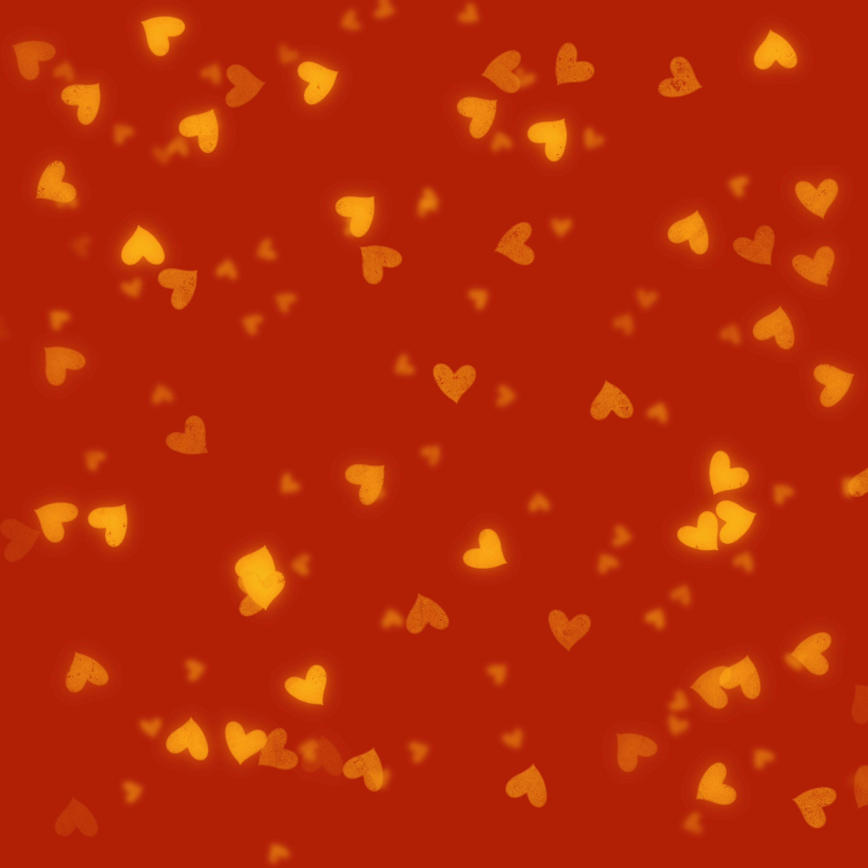 Red background with scattered golden hearts