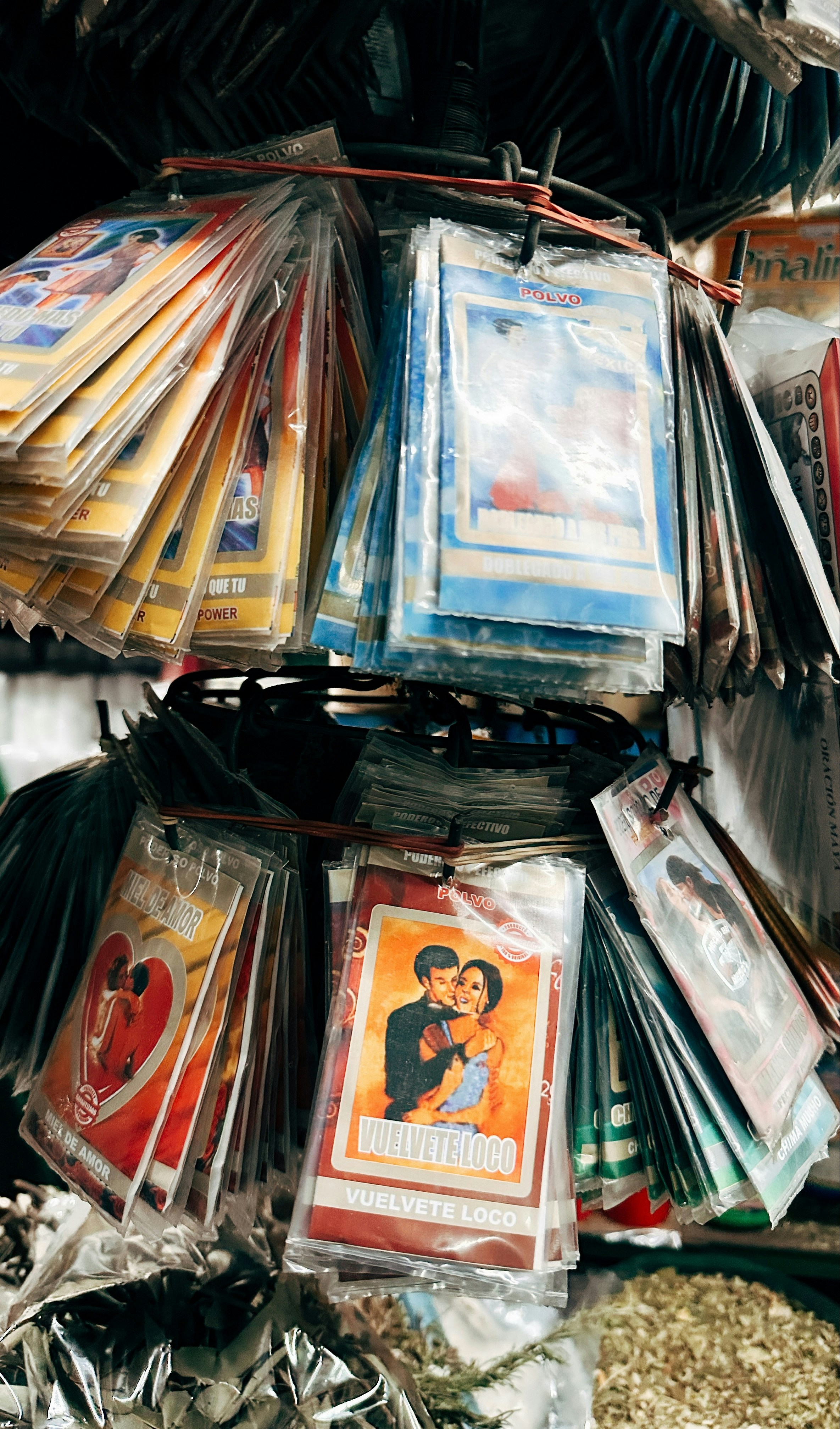 Packets of religious or spiritual items hanging for sale.