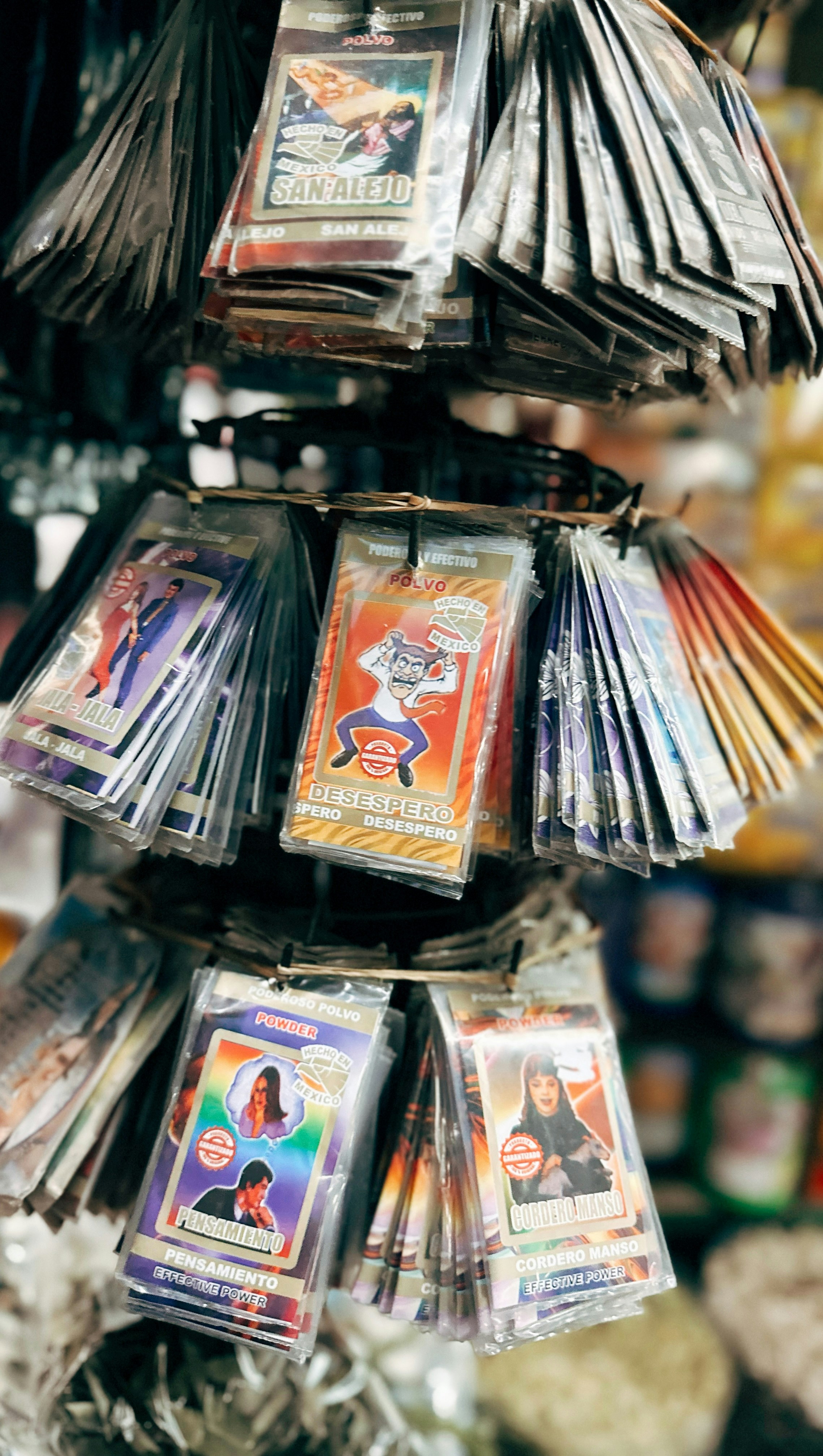 Collection of various trading cards displayed on rack