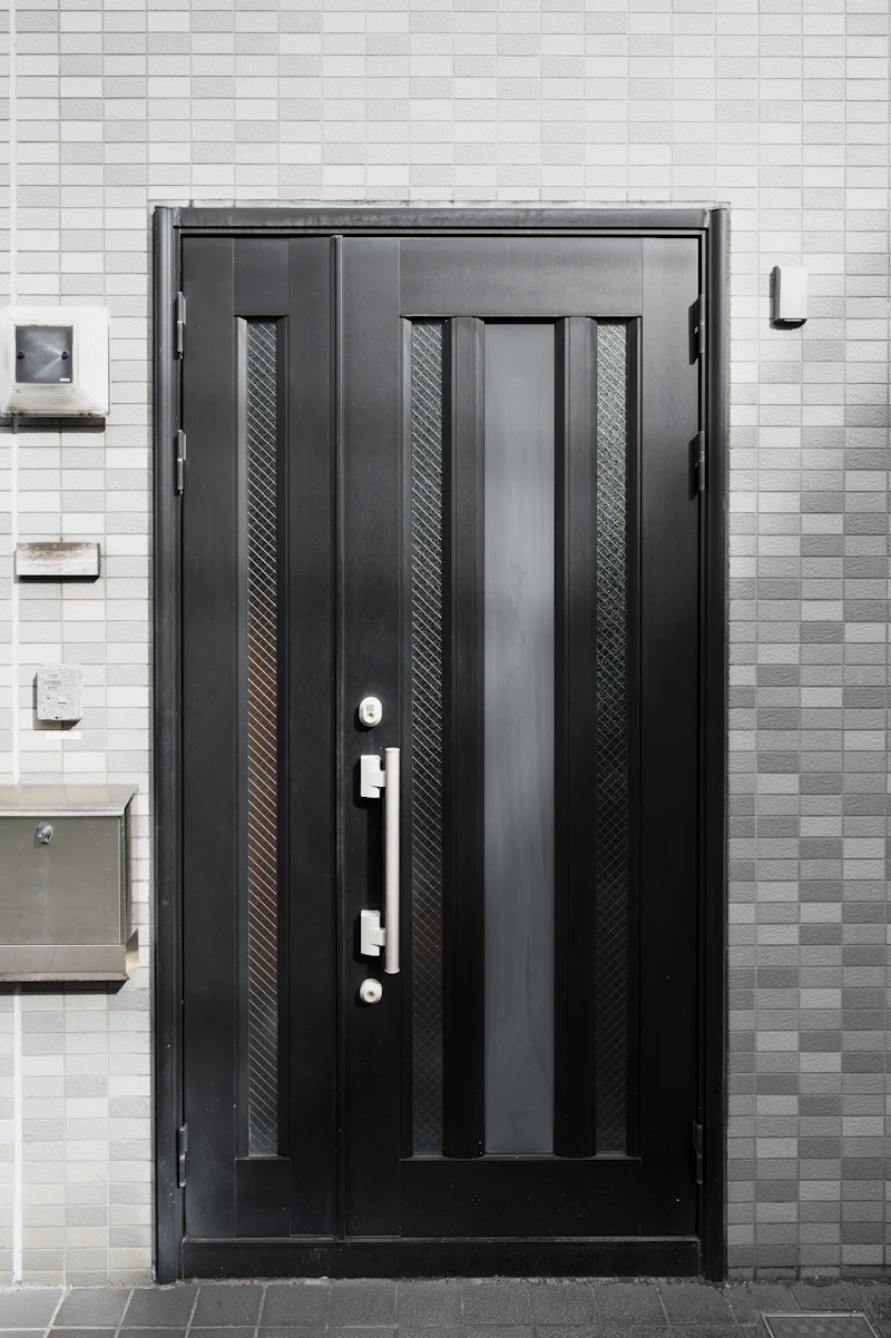 Black-framed glass entry door