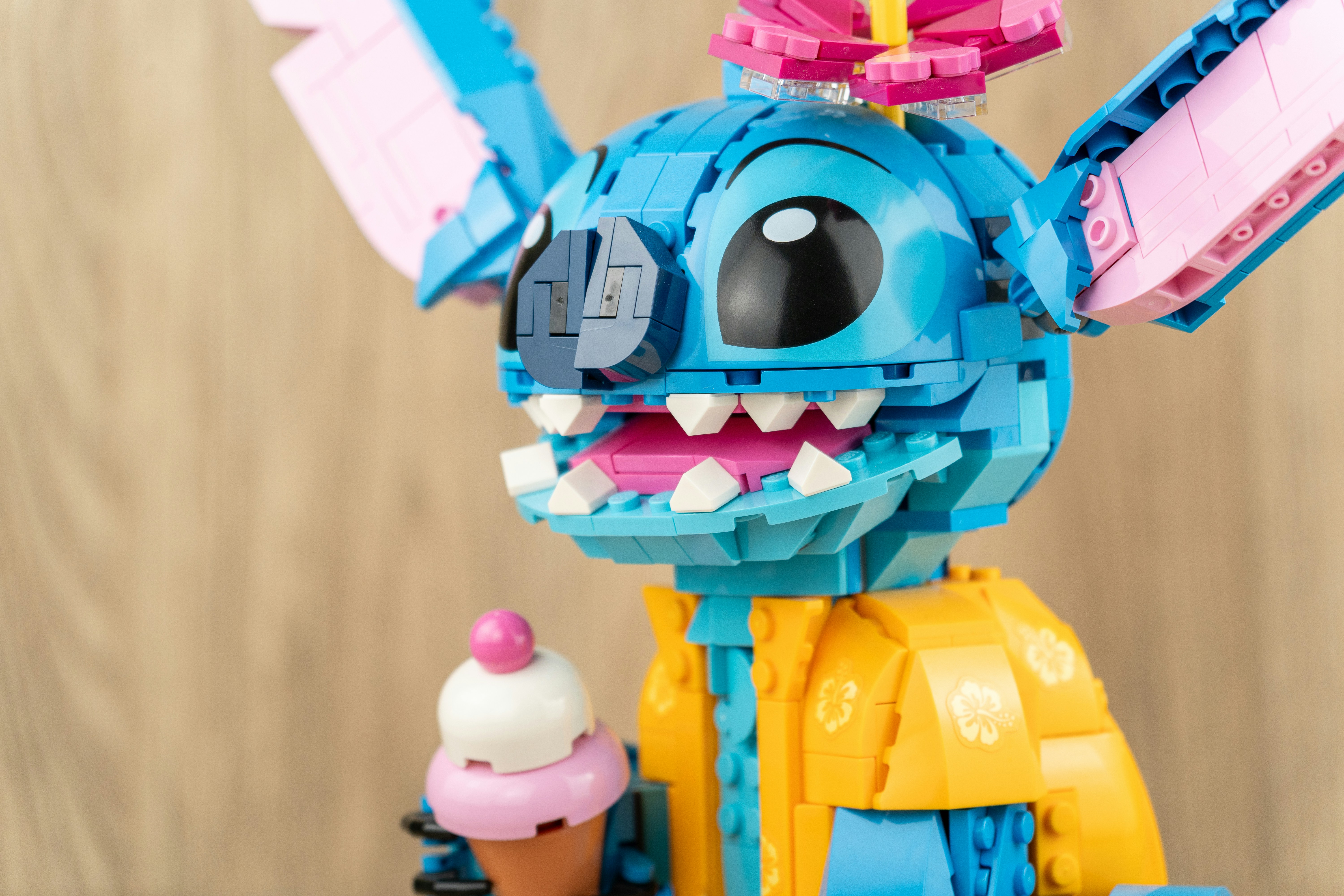 Lego stitch character holding an ice cream cone.
