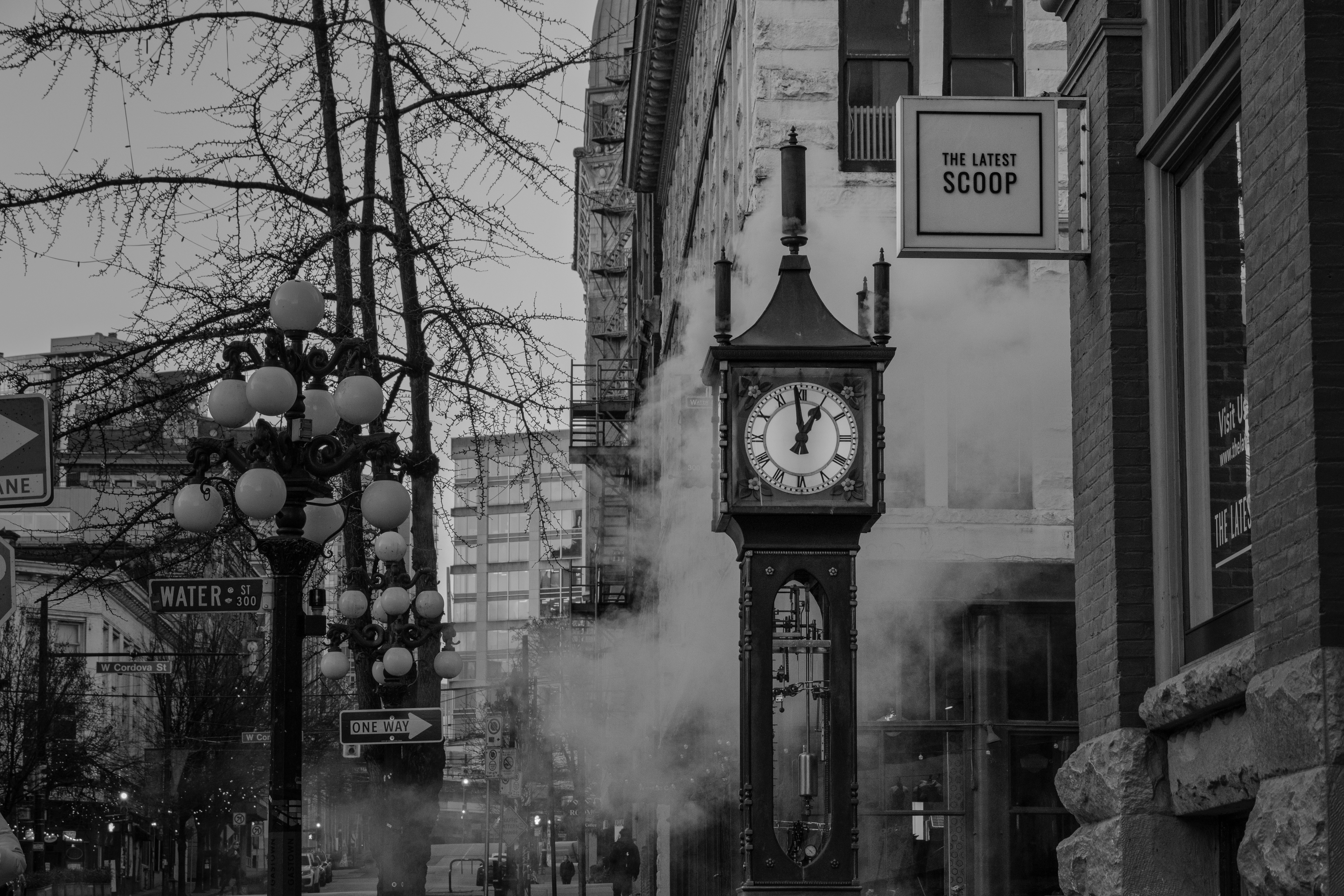 A vintage clock tower on a foggy city street
