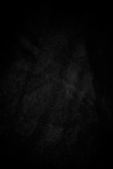 A dark, textured background with subtle white speckles.