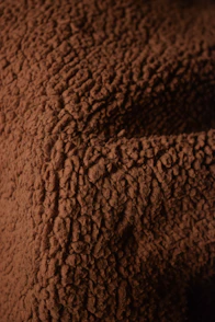 Close-up texture of brown fuzzy fabric