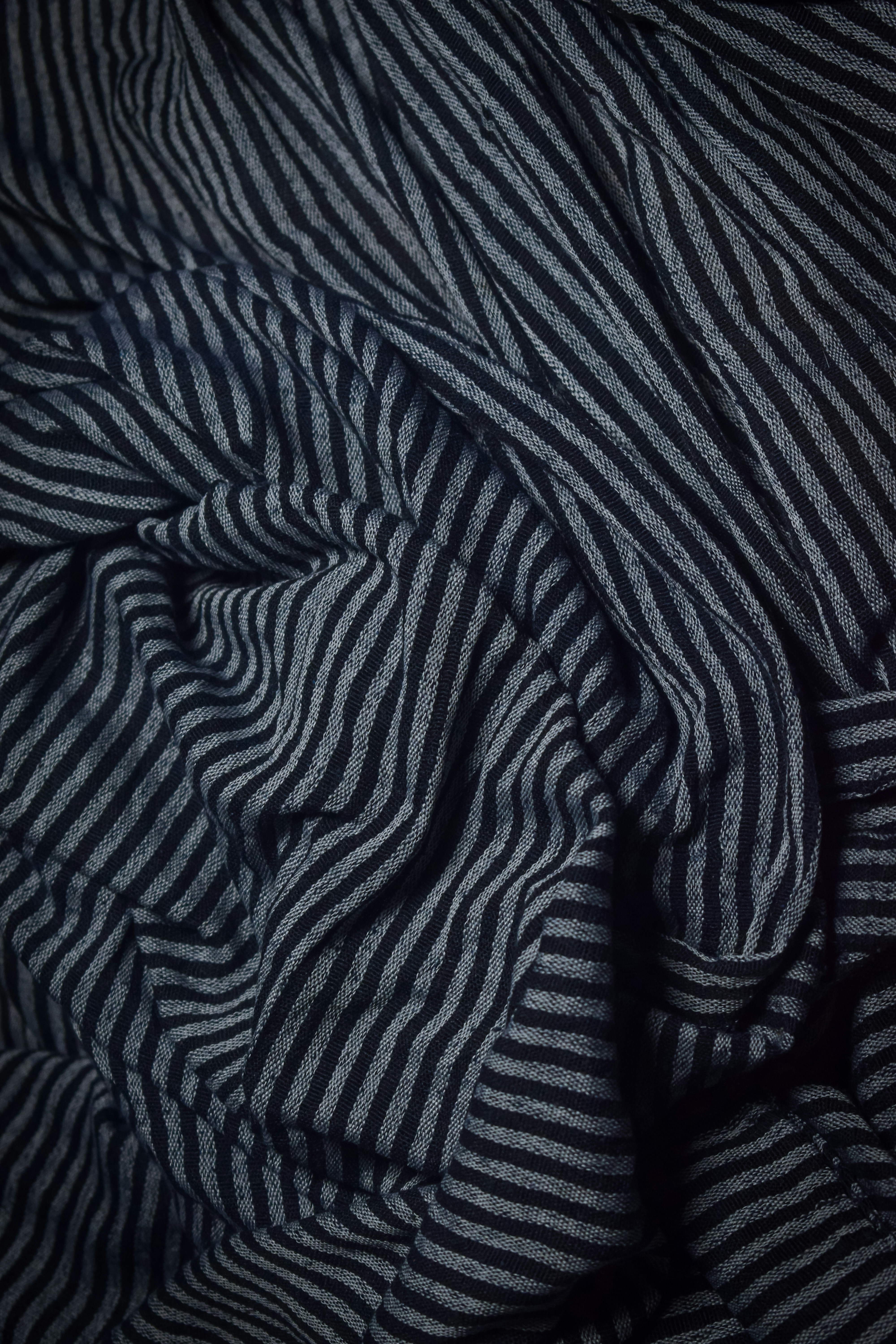 Dark and light gray striped fabric folds