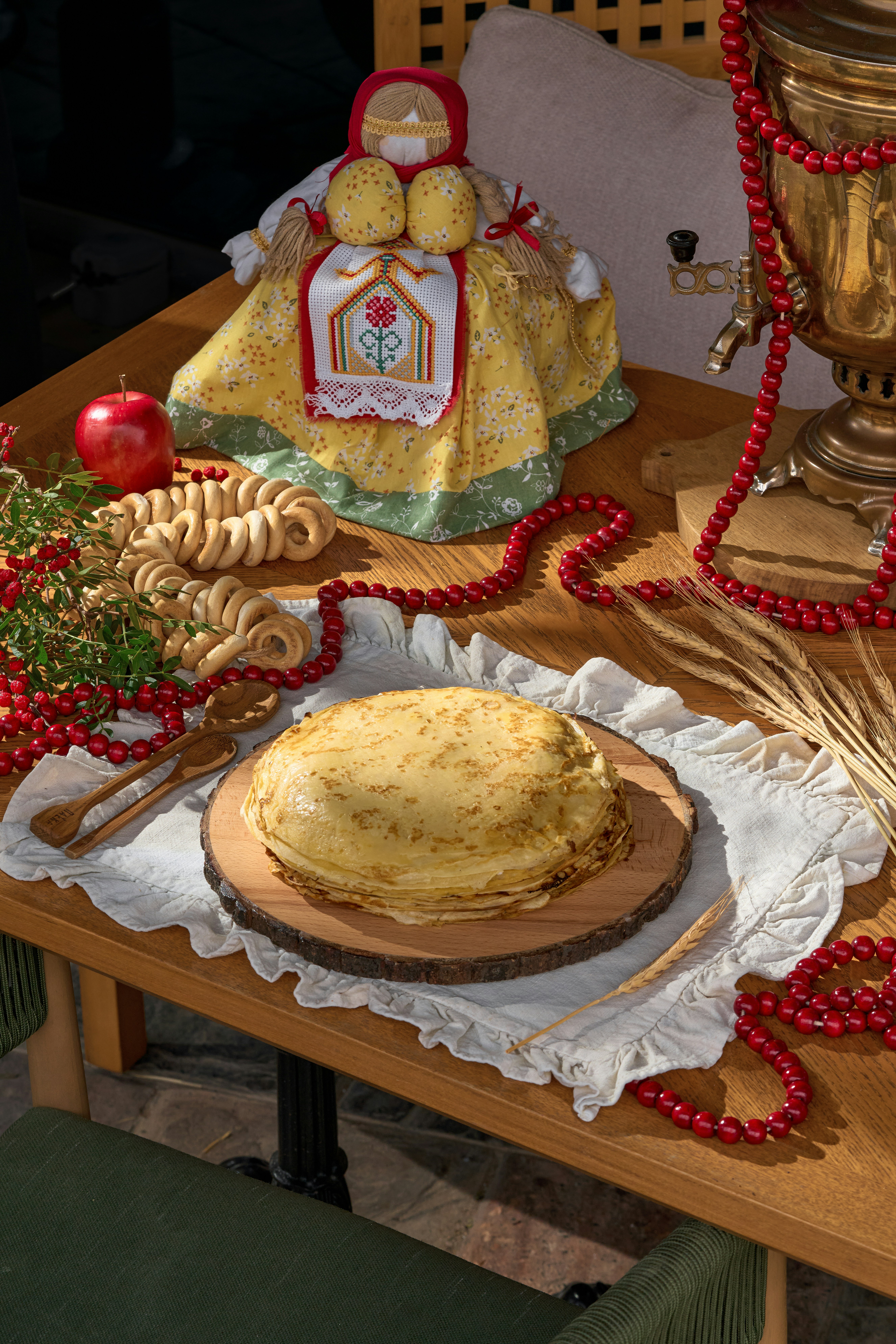 Stack of crepes with traditional russian decorations