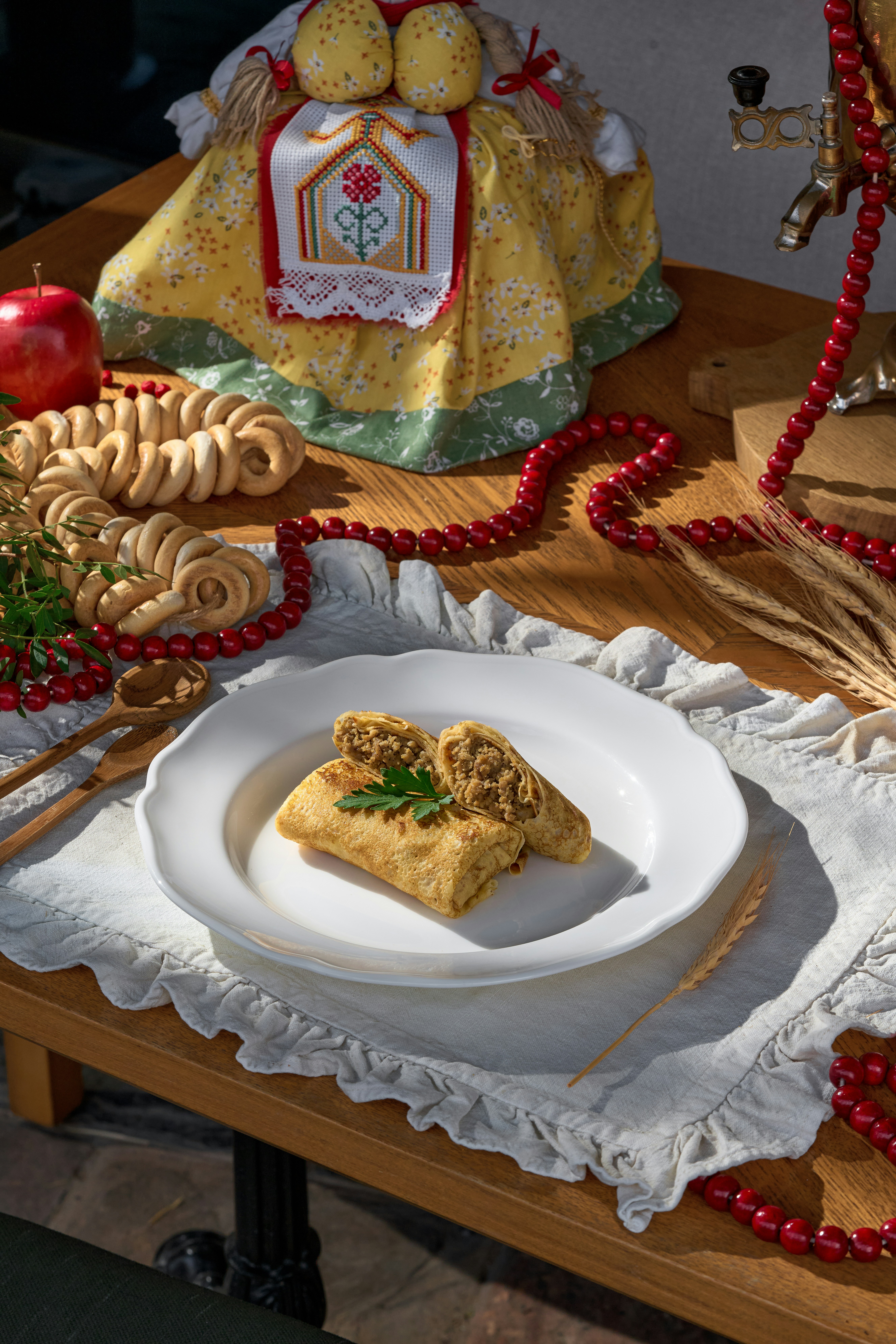Savory pastry with filling on a white plate.
