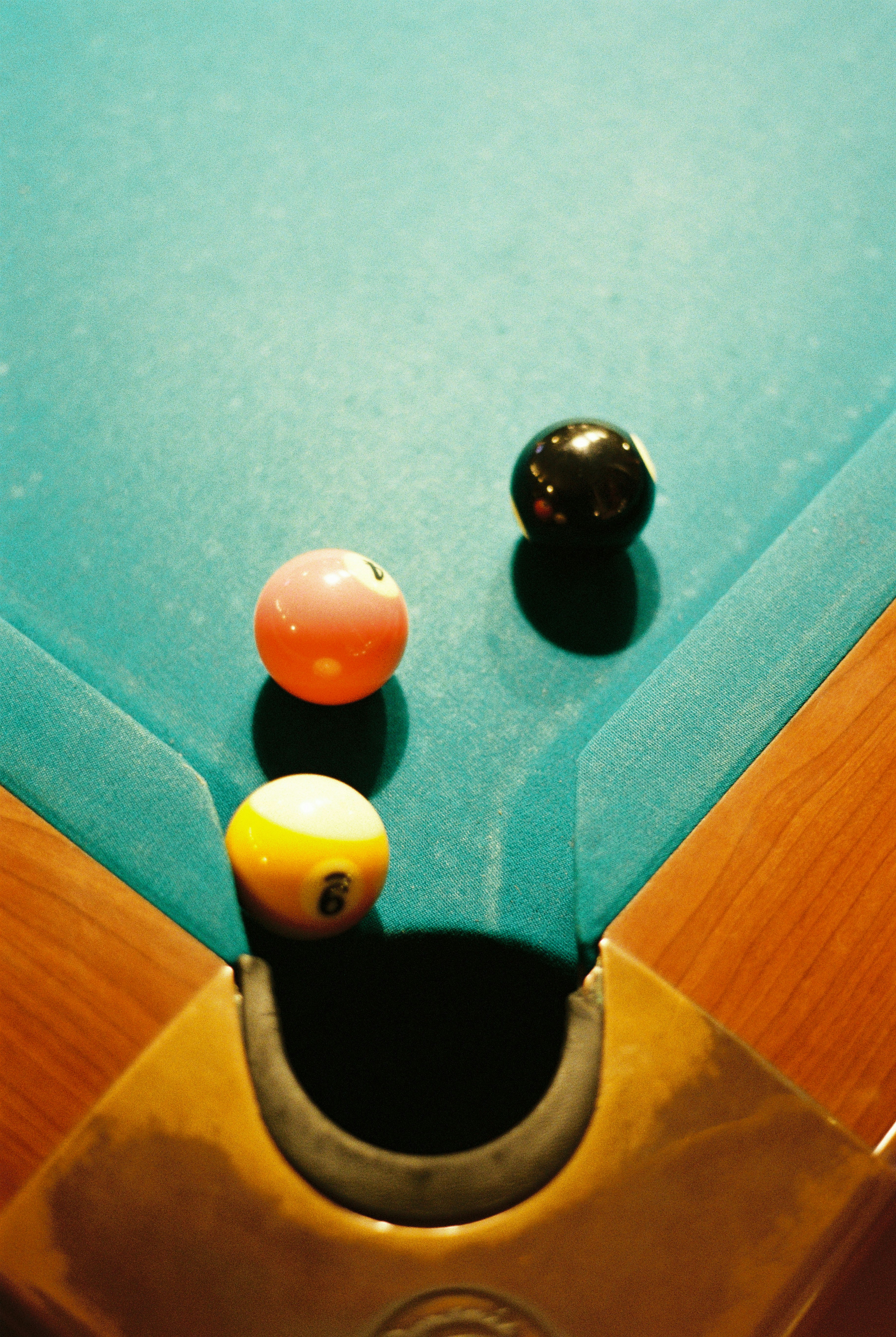 Closeup of billiard balls on green felt table